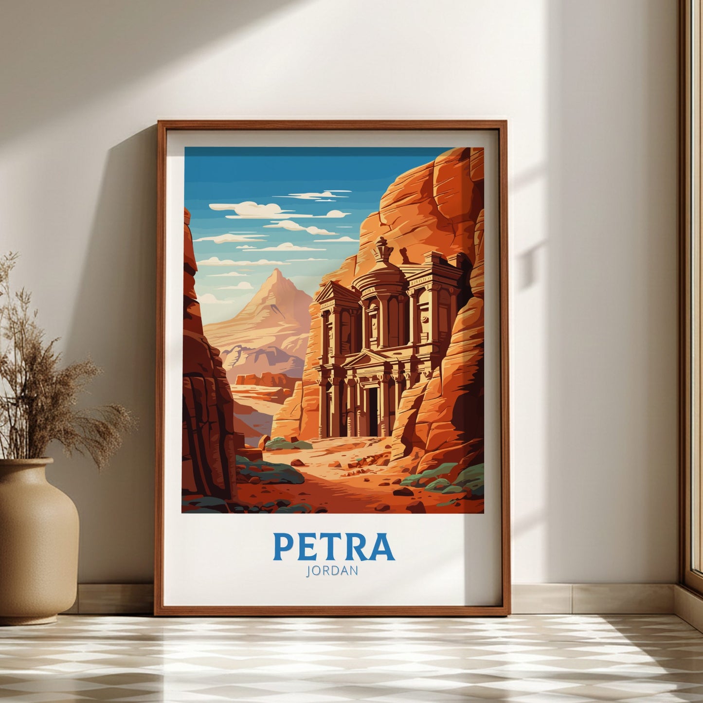 Framed poster of Petra, Jordan with a wooden frame on a wall.