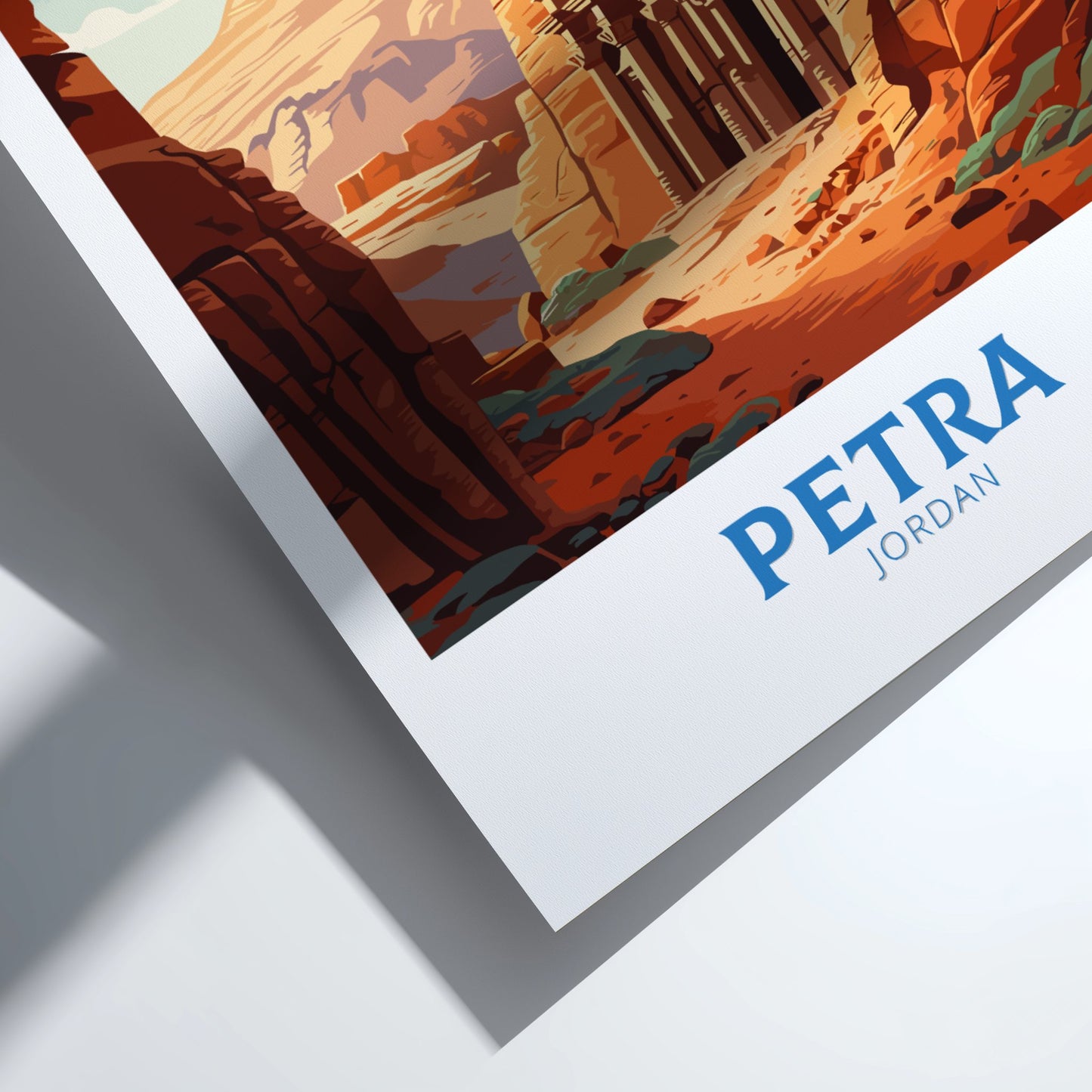 Framed artwork of a desert landscape with 'Petra Jordan' text.