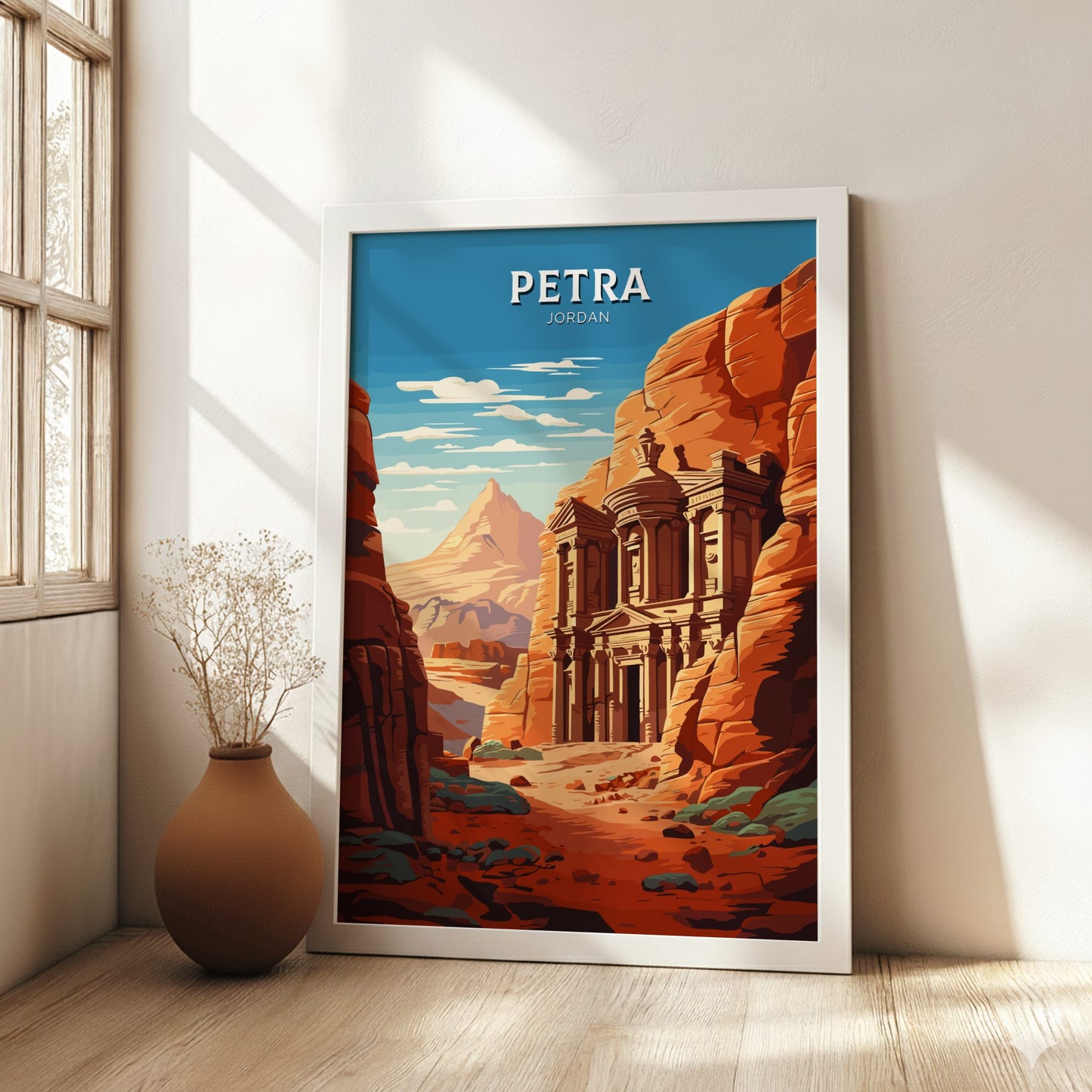 Framed poster of Petra, Jordan with a scenic view in a room with a vase.