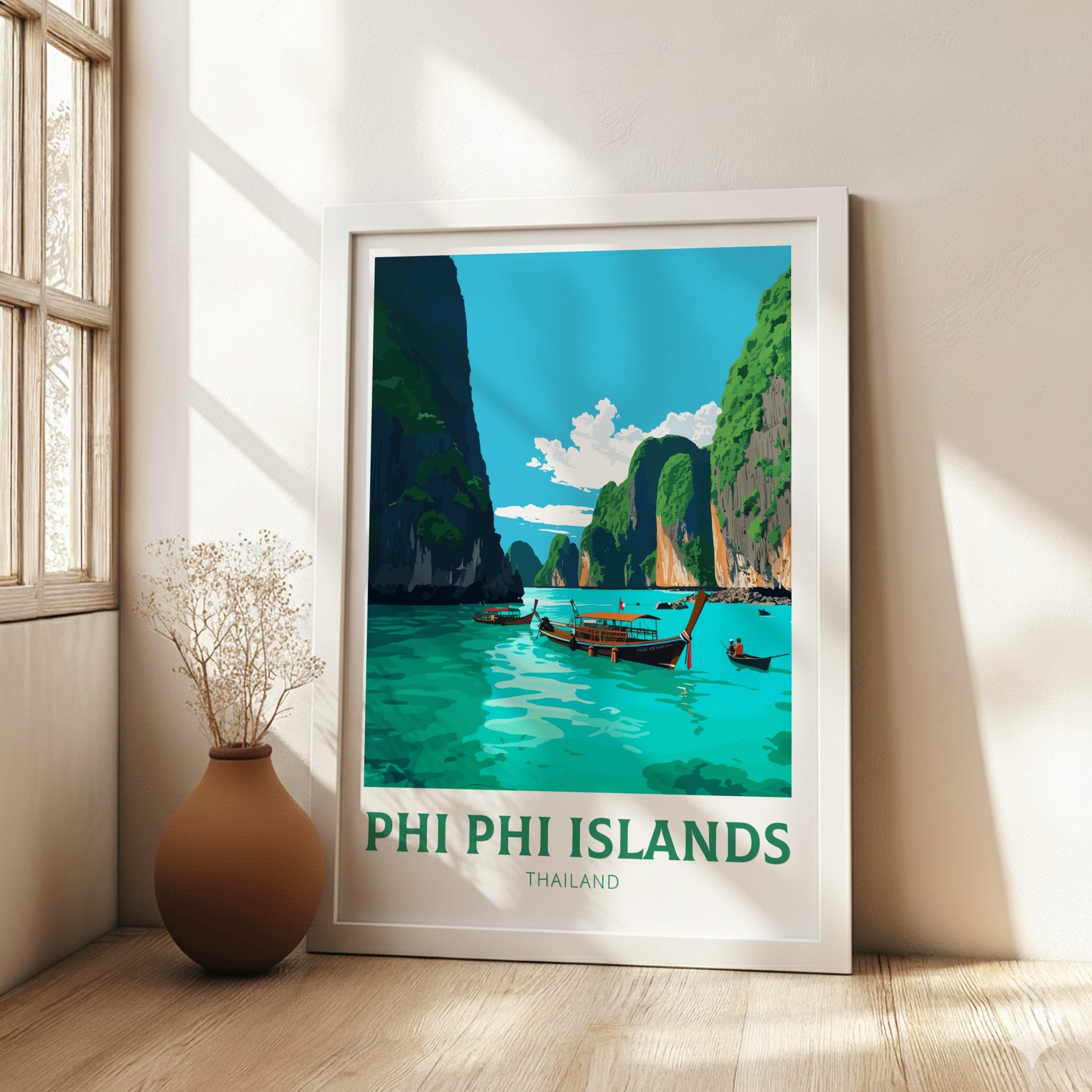Framed poster of Phi Phi Islands, Thailand in a room with a vase and window.