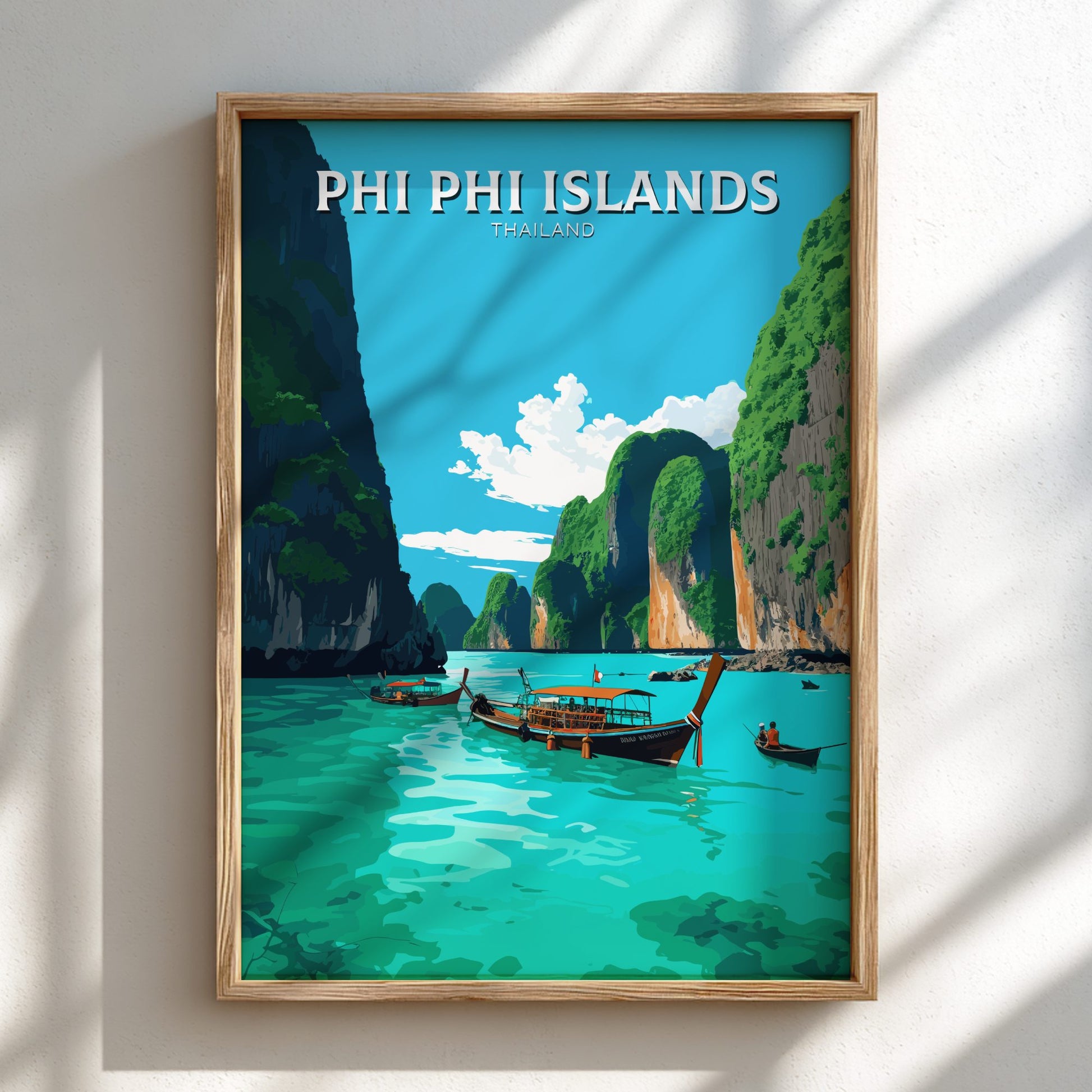 Framed artwork of Phi Phi Islands with boats and cliffs on a blue sky background.