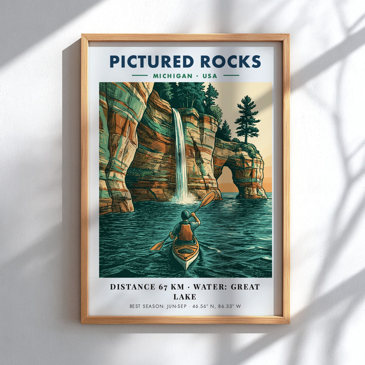 Poster of a kayaker paddling beneath colorful Pictured Rocks cliffs and a waterfall