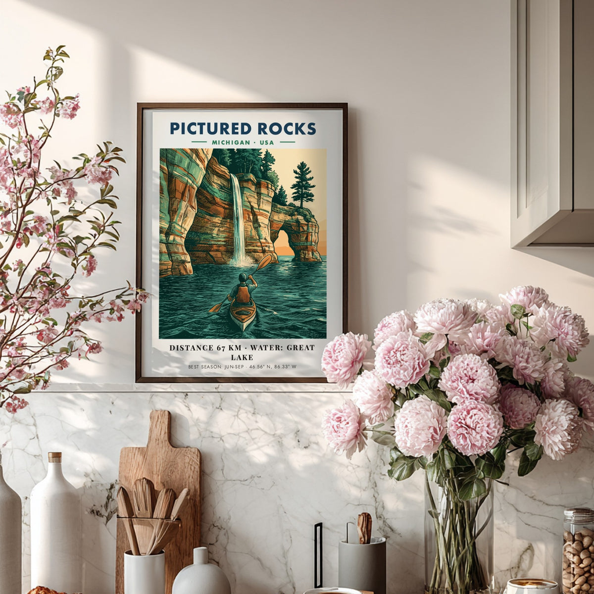 Poster of a kayaker paddling beneath colorful Pictured Rocks cliffs and a waterfall