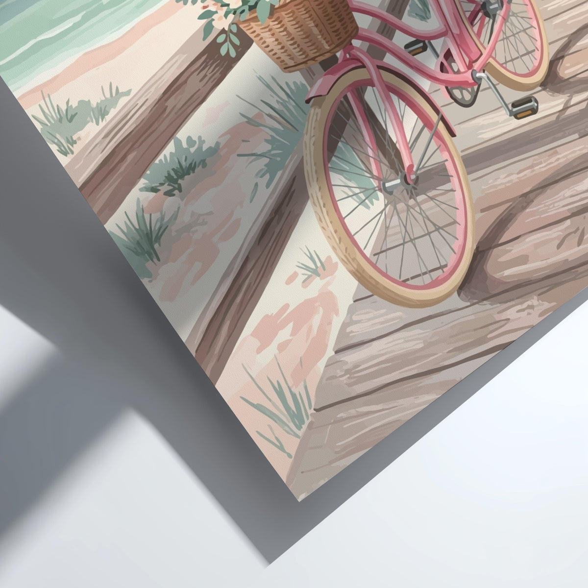 Pink beach cruiser bicycle with a flower basket on a wooden boardwalk near ocean