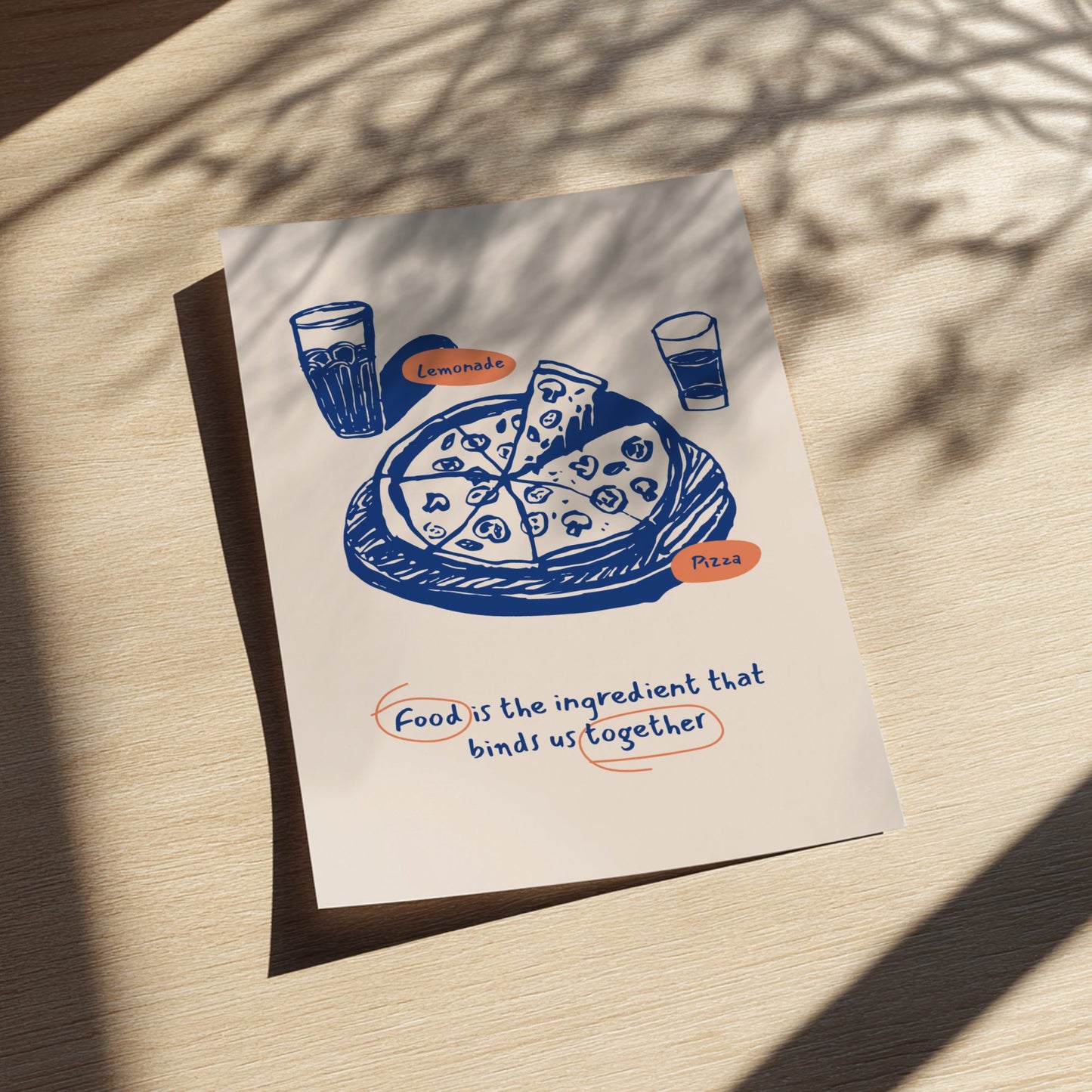 Card with pizza illustration and text on a wooden surface