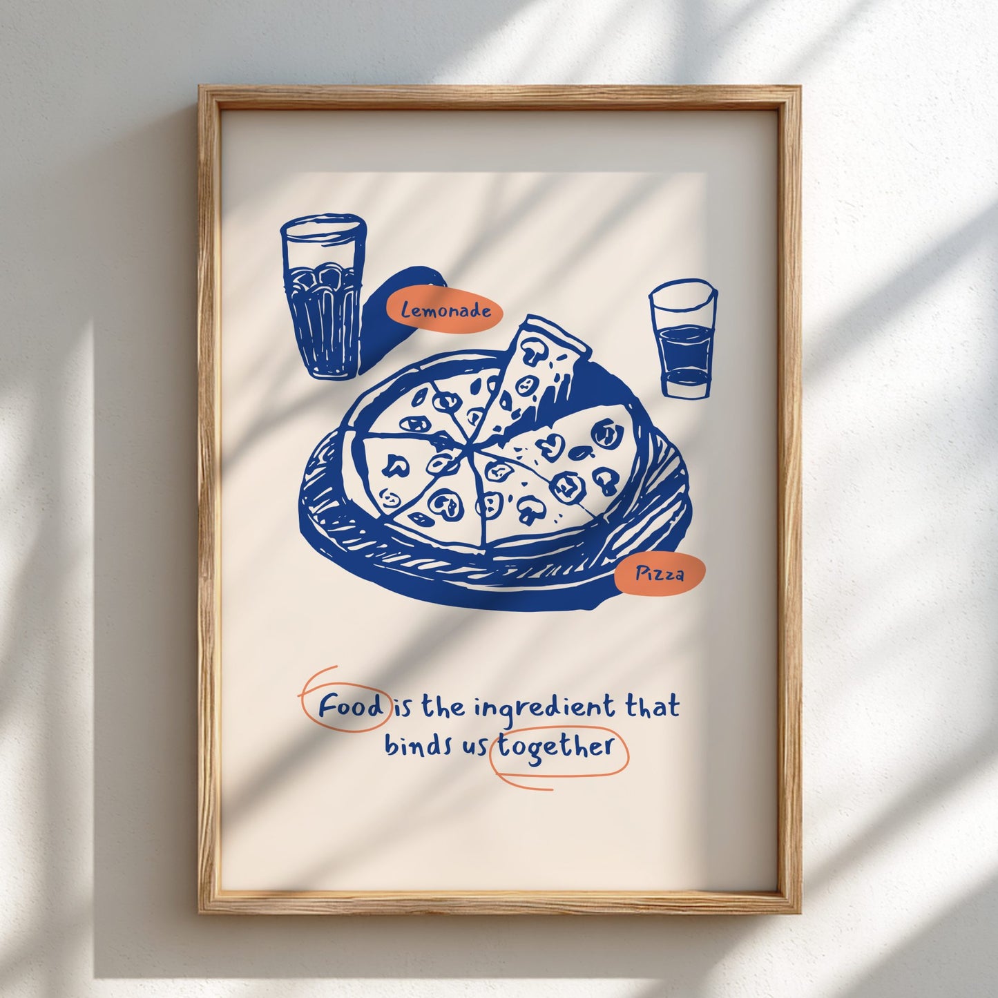 Framed artwork with a blue illustration of pizza and lemonade on a white background