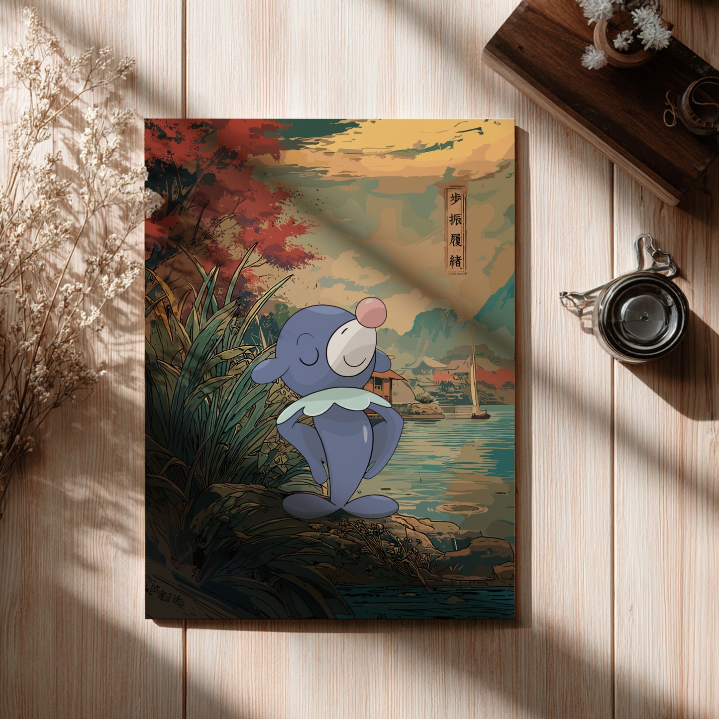 Poster with Popplio Pokemon character on a scenic cover, placed on a wooden surface.