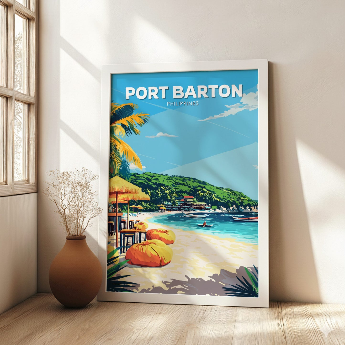 Framed artwork of Port Barton, Philippines on a wall in a bright room with a vase.