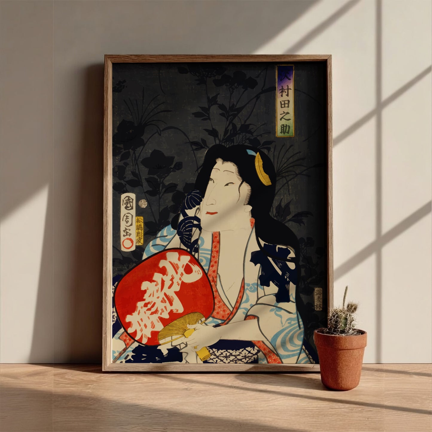 Poster of a Japanese actor portrait in ukiyo-e style by Toyohara Kunichika, featuring red fan.