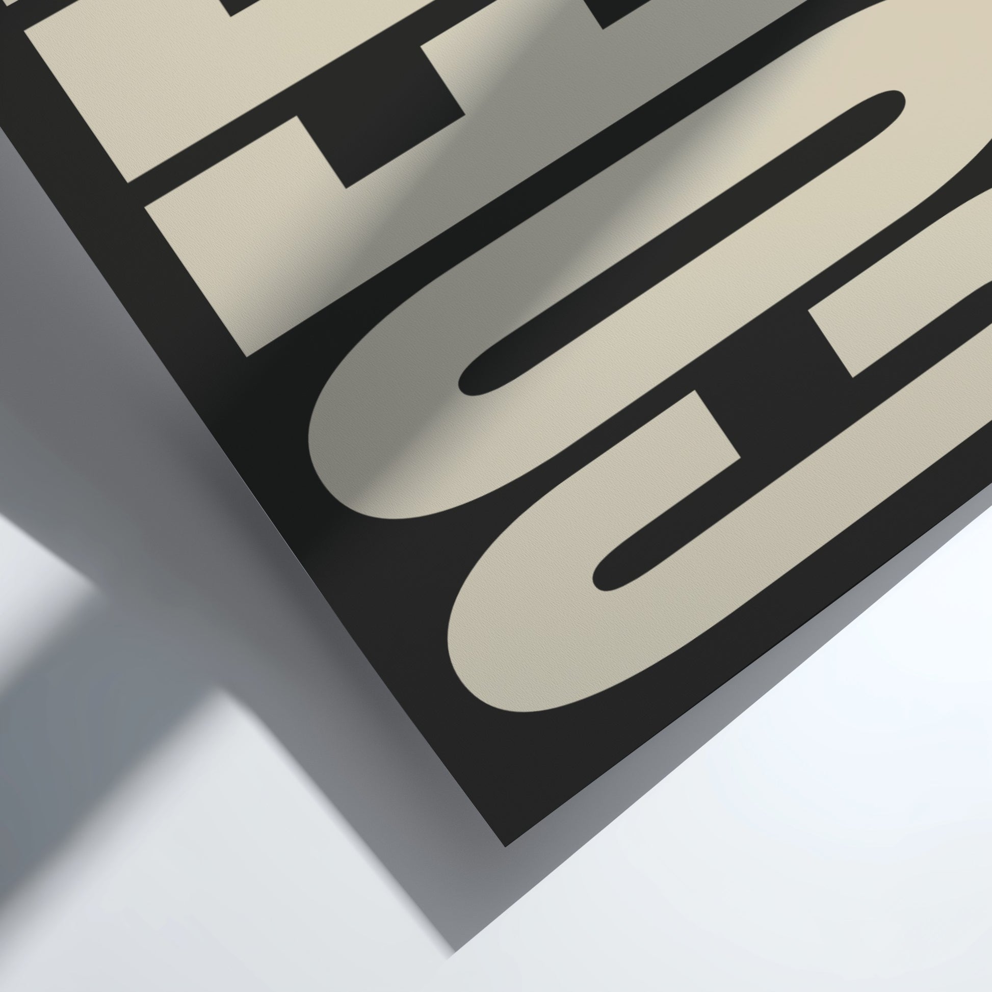 Close-up of a logo with 'G' and 'C' on a beige and black background