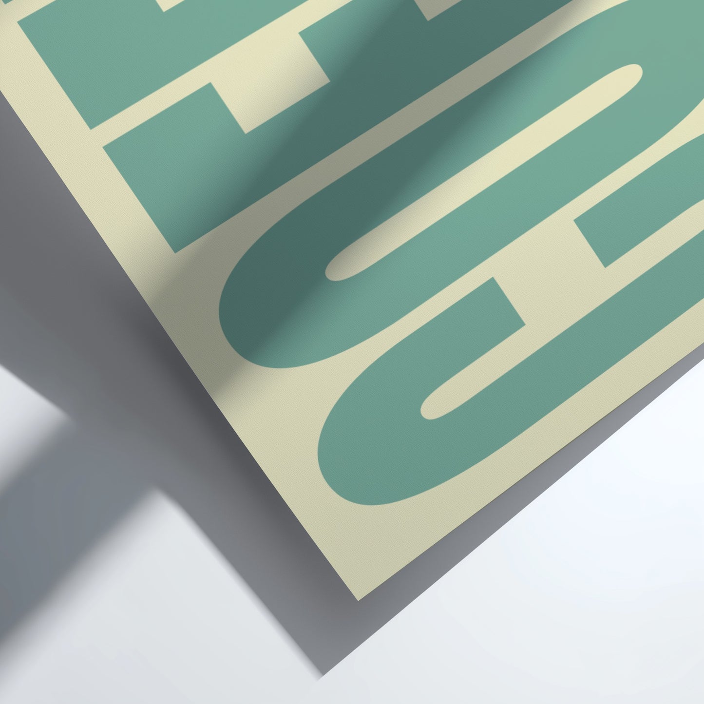 Close-up of a green and beige product packaging with text on a white background