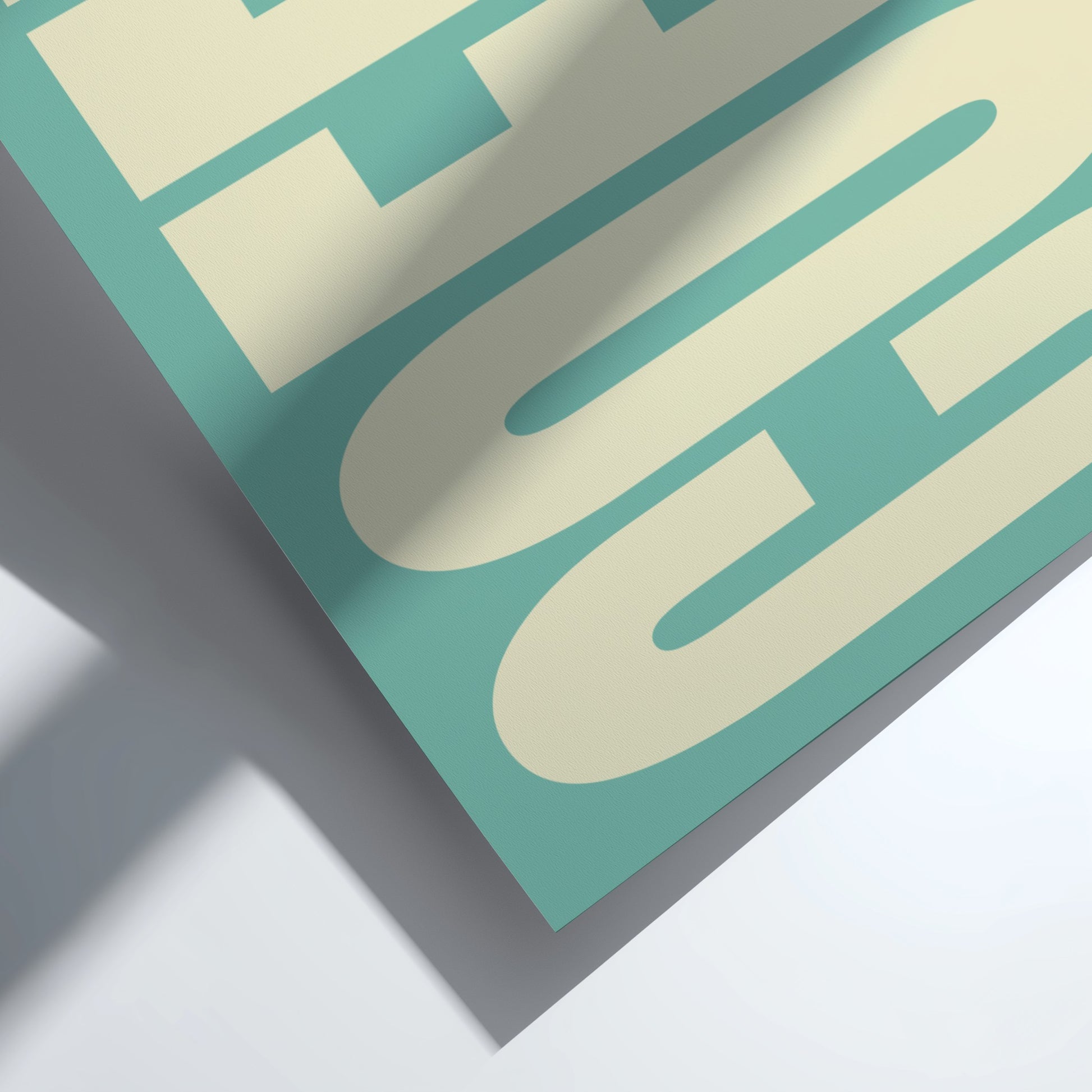 Close-up of a teal and beige geometric design on a white background