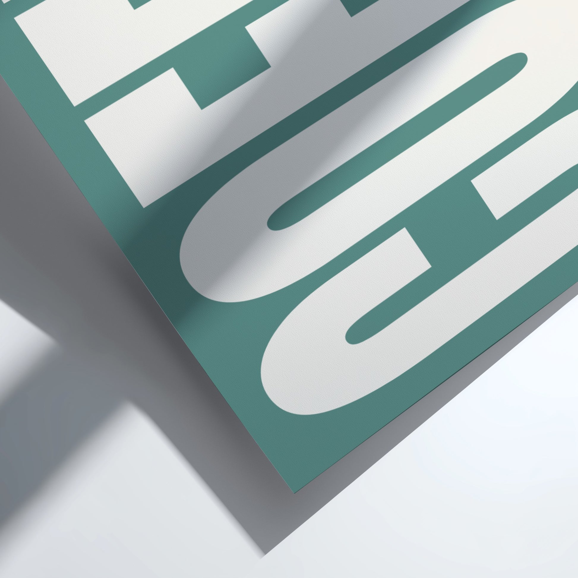 Close-up of a green and white logo on a light gray background
