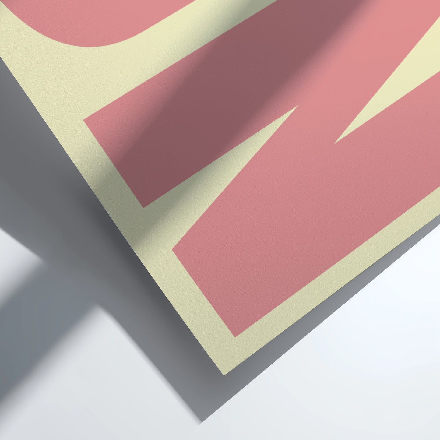 Close-up of a pink and beige geometric design on a white background