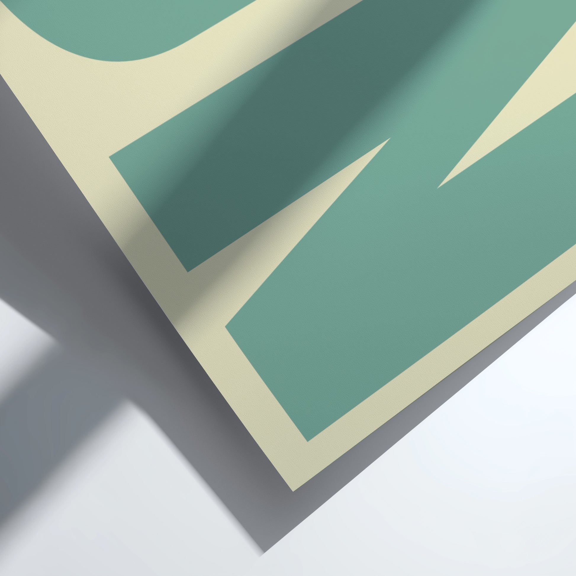 Close-up of a green and beige geometric pattern on a white background