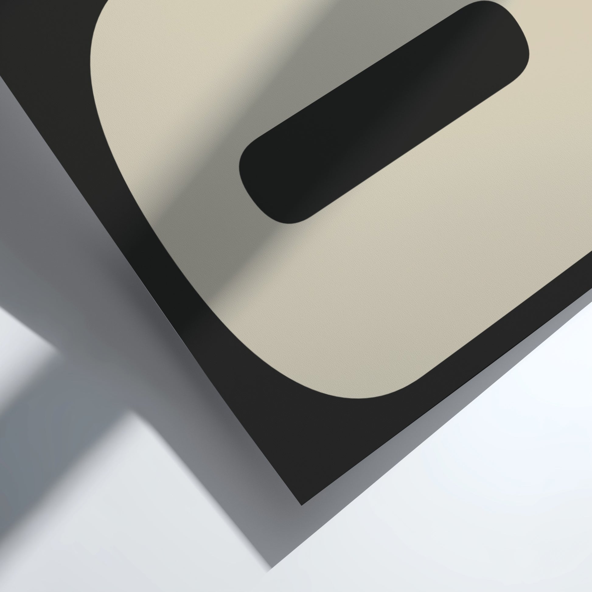 Abstract geometric design with black, gray, and beige shapes on a white background