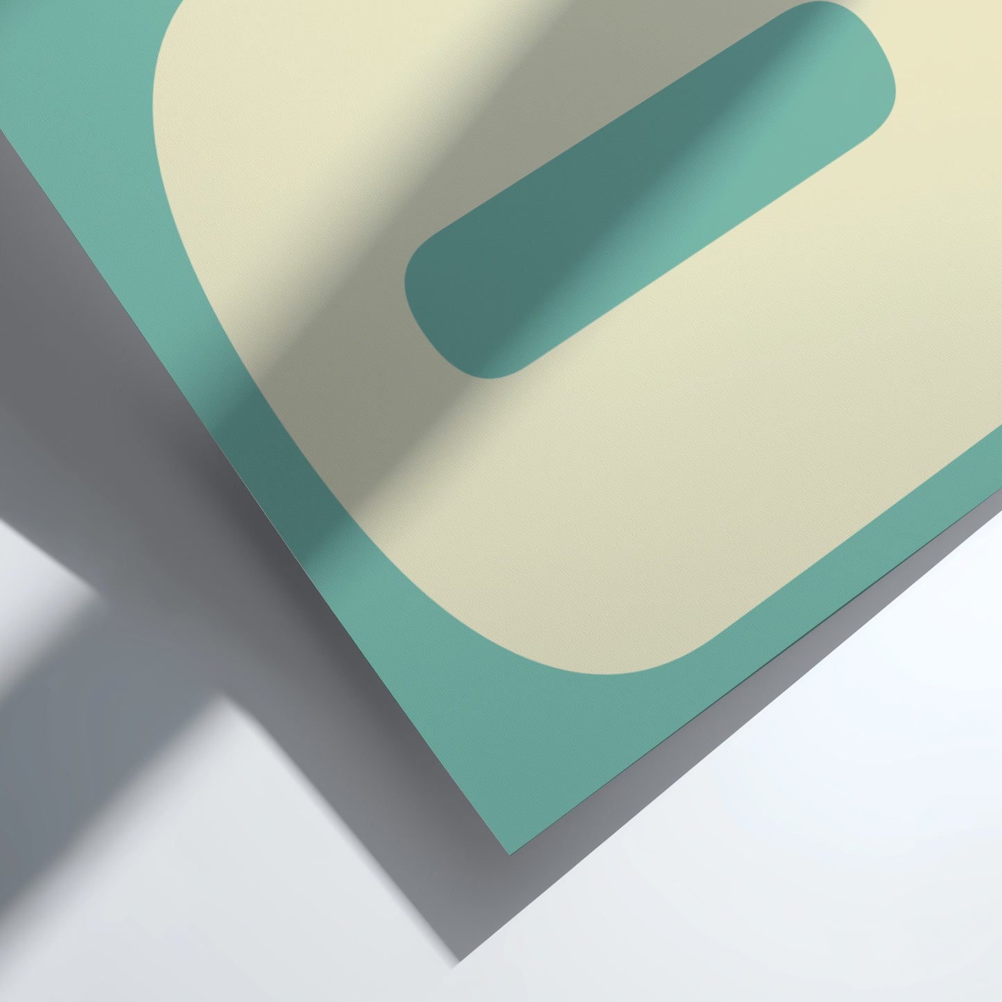 Geometric shapes in teal, beige, and gray on a light background