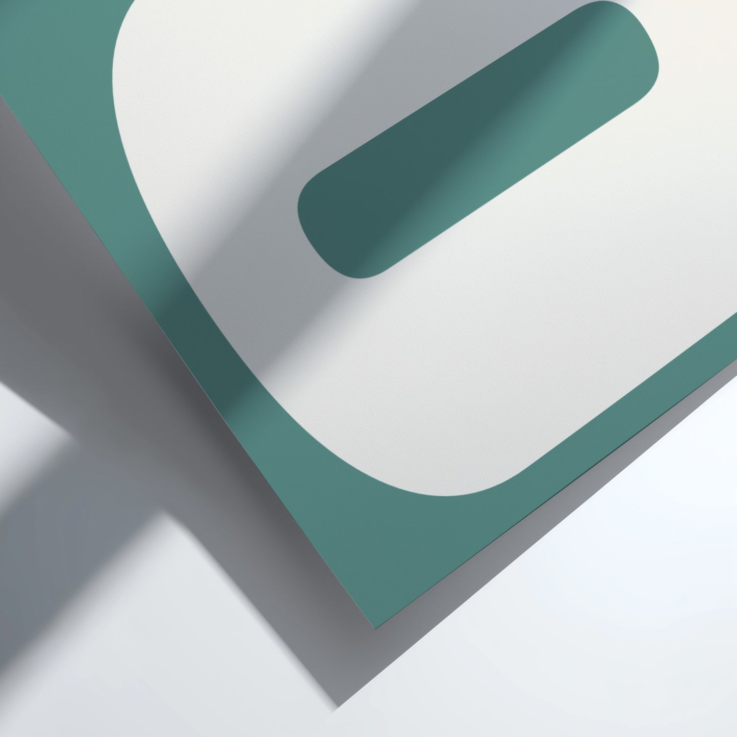 Teal and gray geometric shapes on a white background