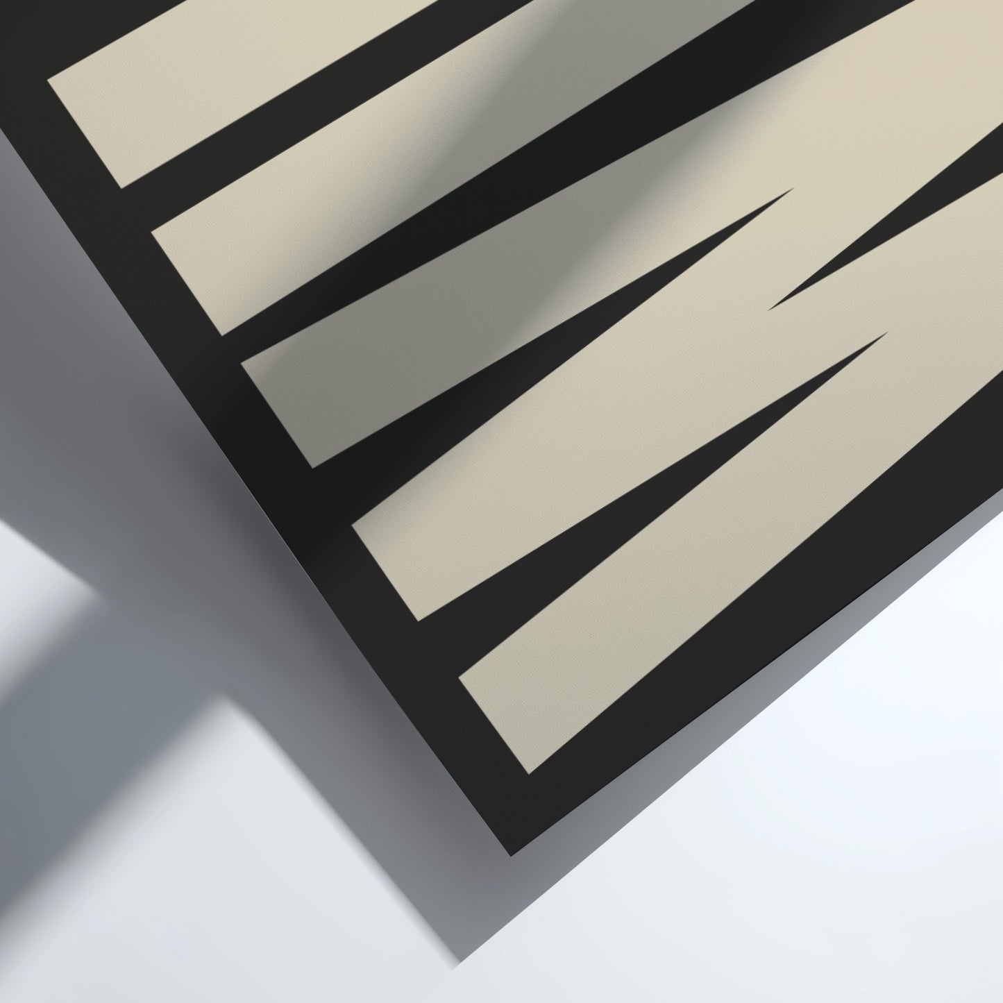 Close-up of a bold typography, modern wall art for home decor black and beige lines on a white background