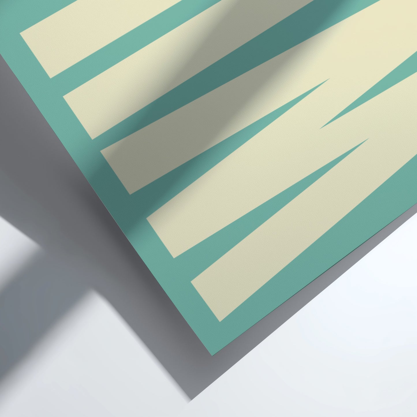Close-up of a teal and beige striped pattern on a flat surface