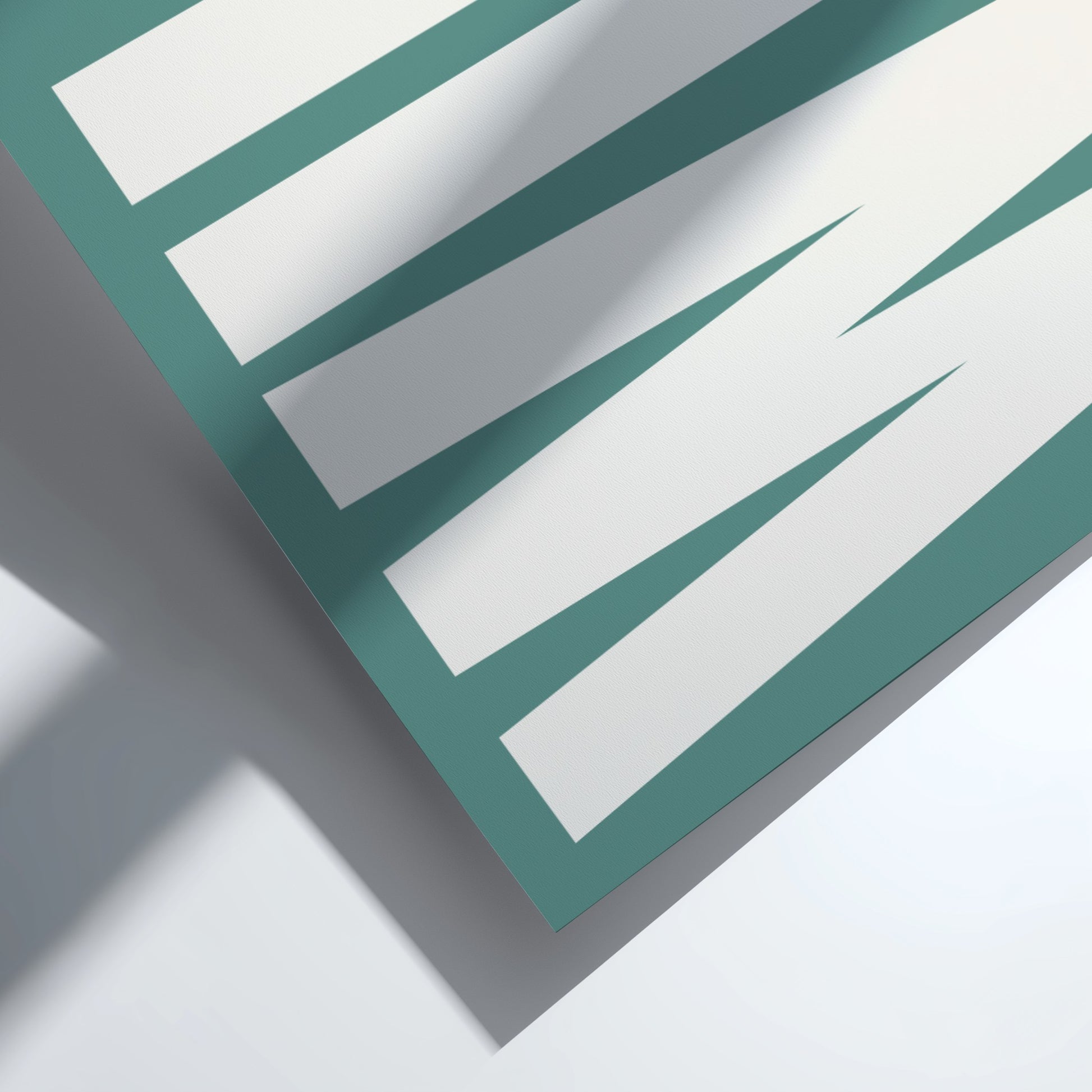 Close-up of a teal and white bold typography, modern wall art for home decor