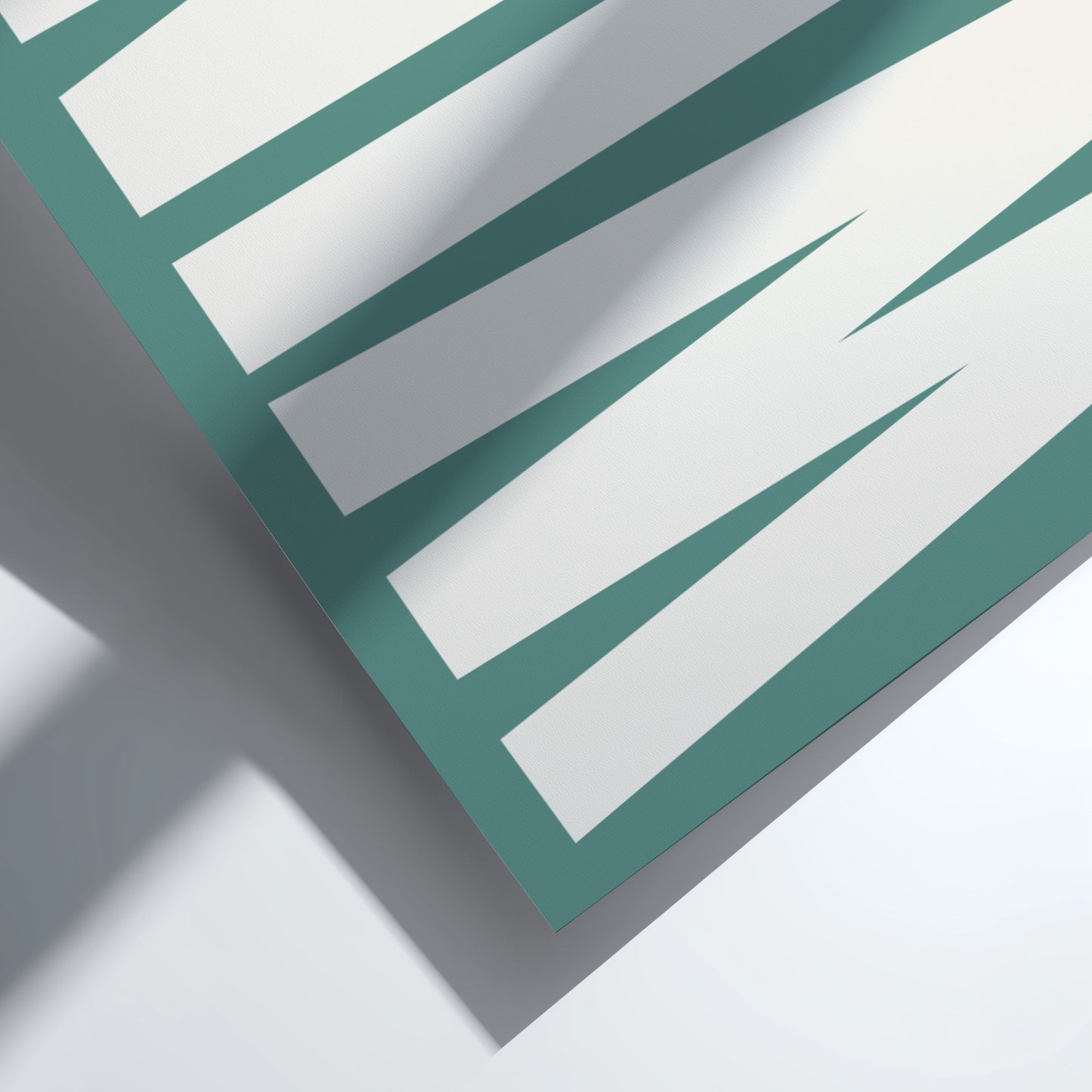 Close-up of a green and white striped pattern on a flat surface