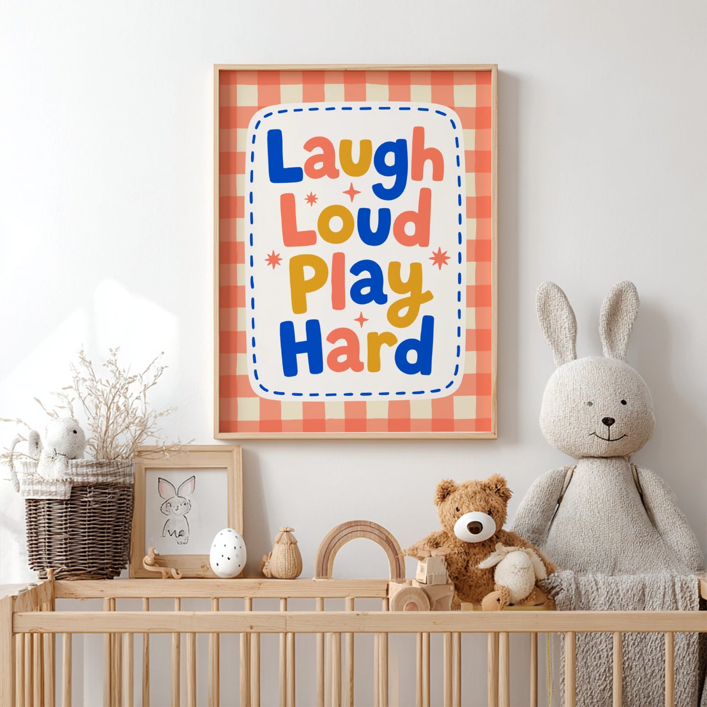 Kids room poster with colorful typography design featuring 'Laugh Loud Play Hard' for nursery decor.