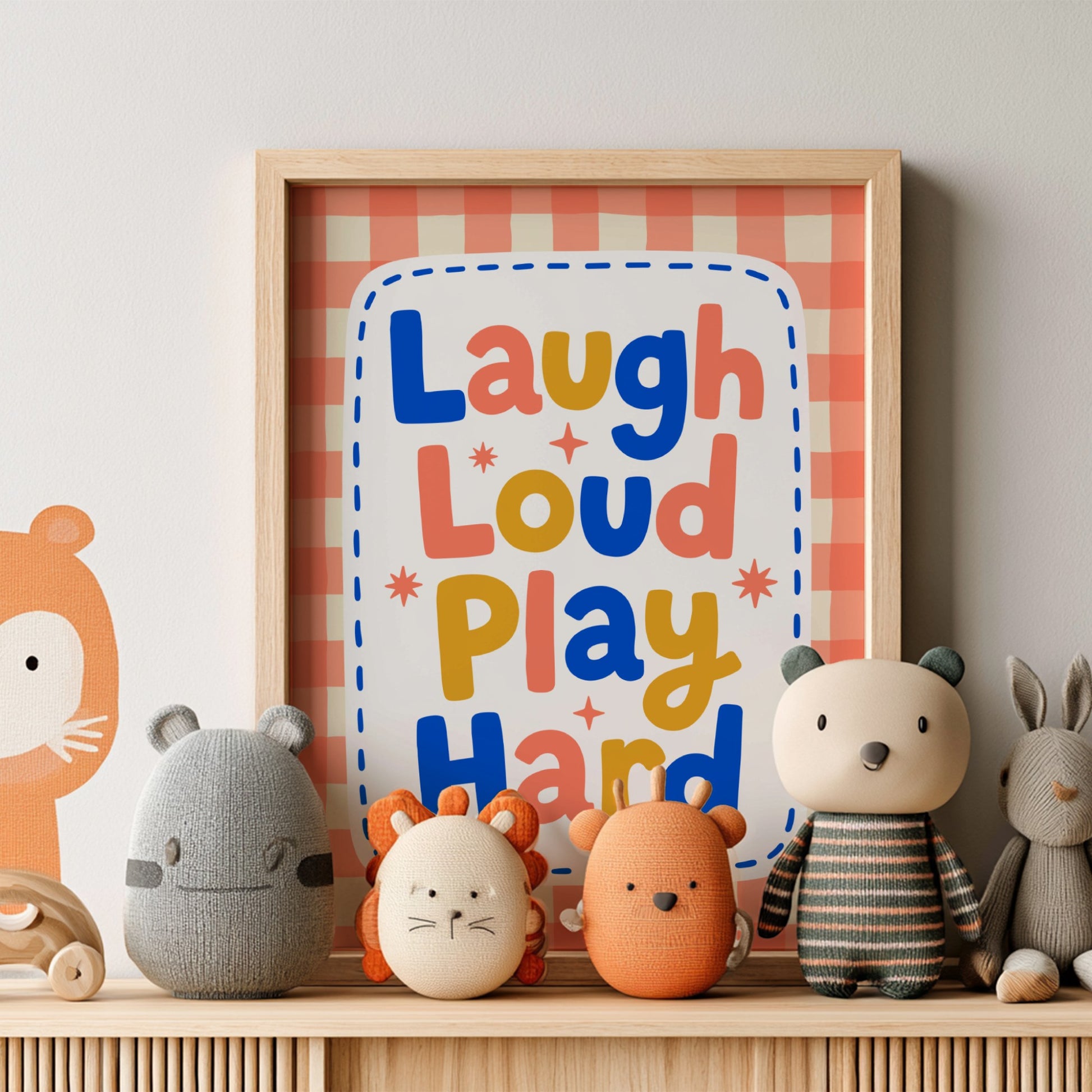 Kids room poster with colorful typography design featuring 'Laugh Loud Play Hard' for nursery decor.