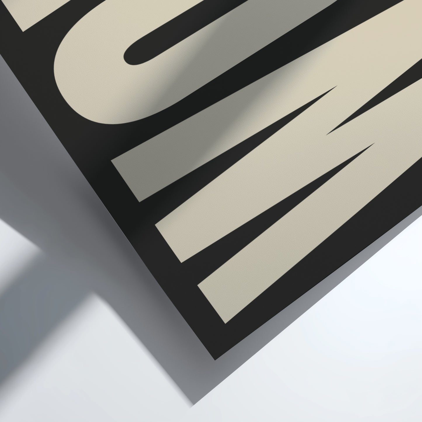 Close-up of an artwork with the word 'WOW' design on a light background