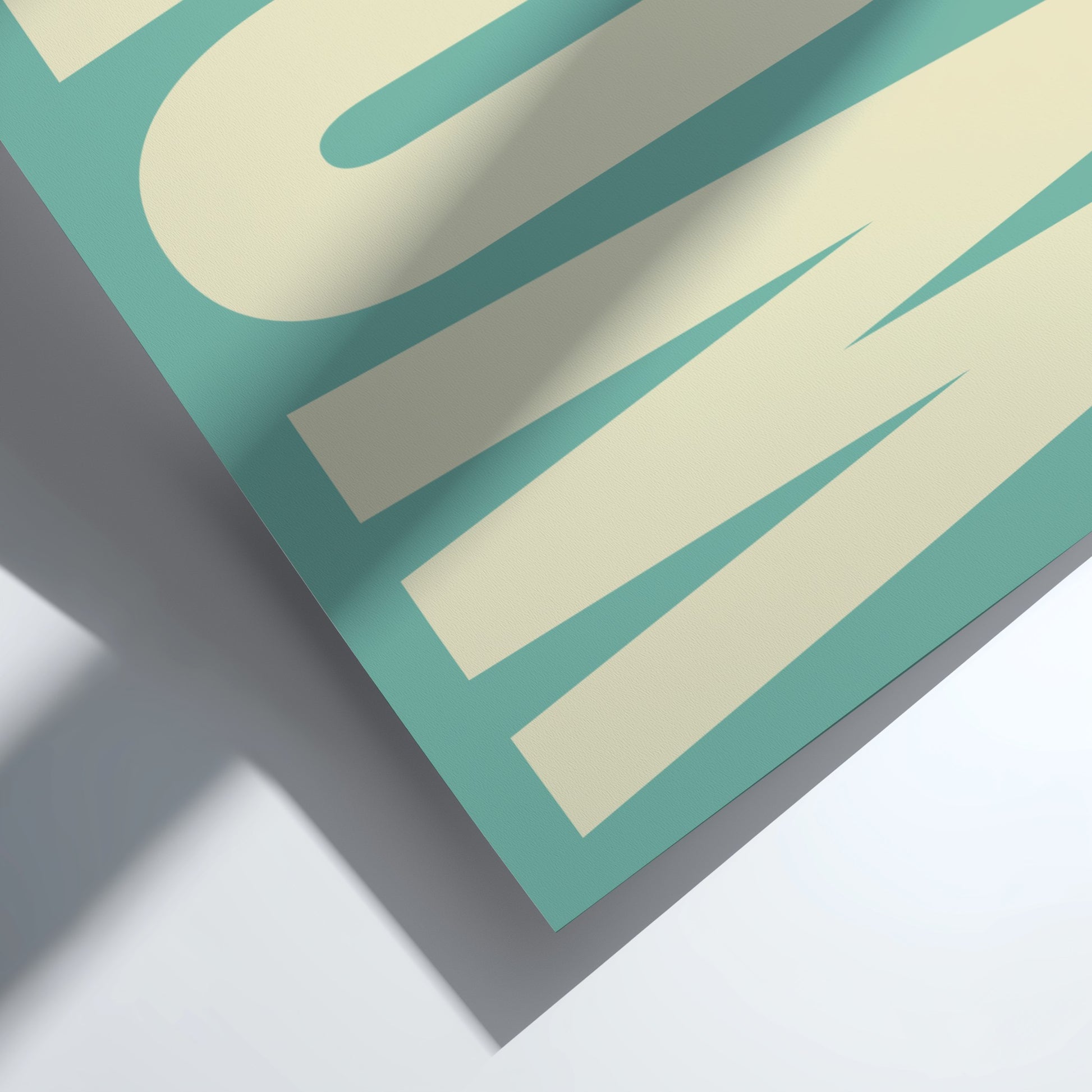 Close-up of a teal and beige poster with text on a white background