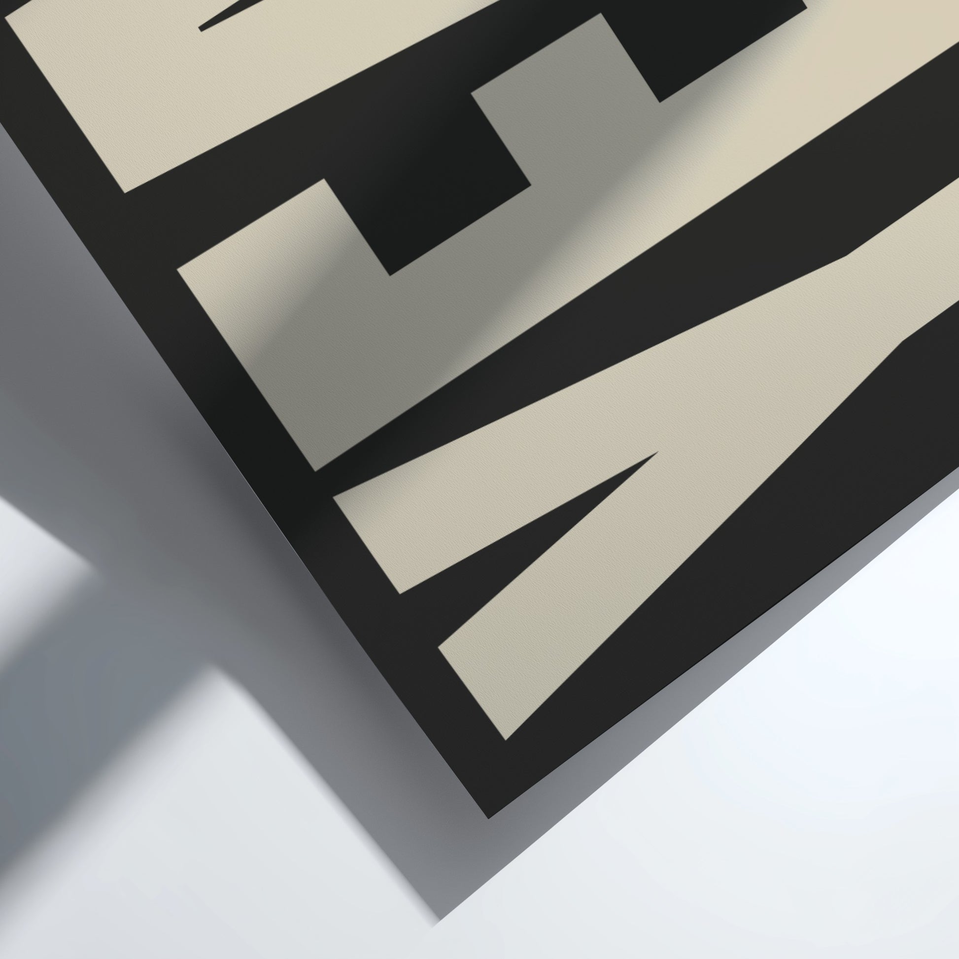 Close-up of a Motivational poster featuring bold 'Yeah' typography  with black and beige colors on a light gray background