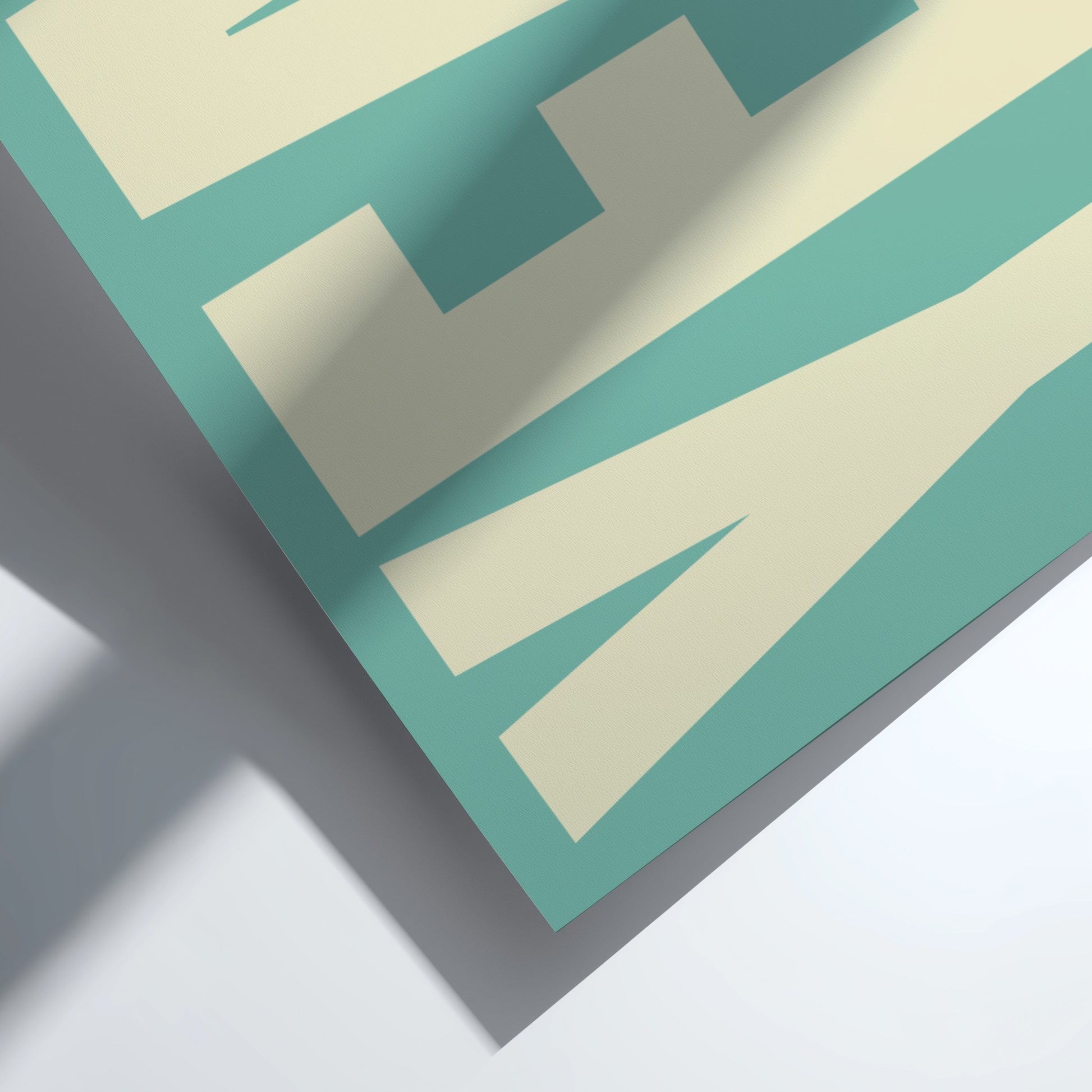 Close-up of a teal and beige Motivational poster featuring bold 'Yeah' typography  design on a white background