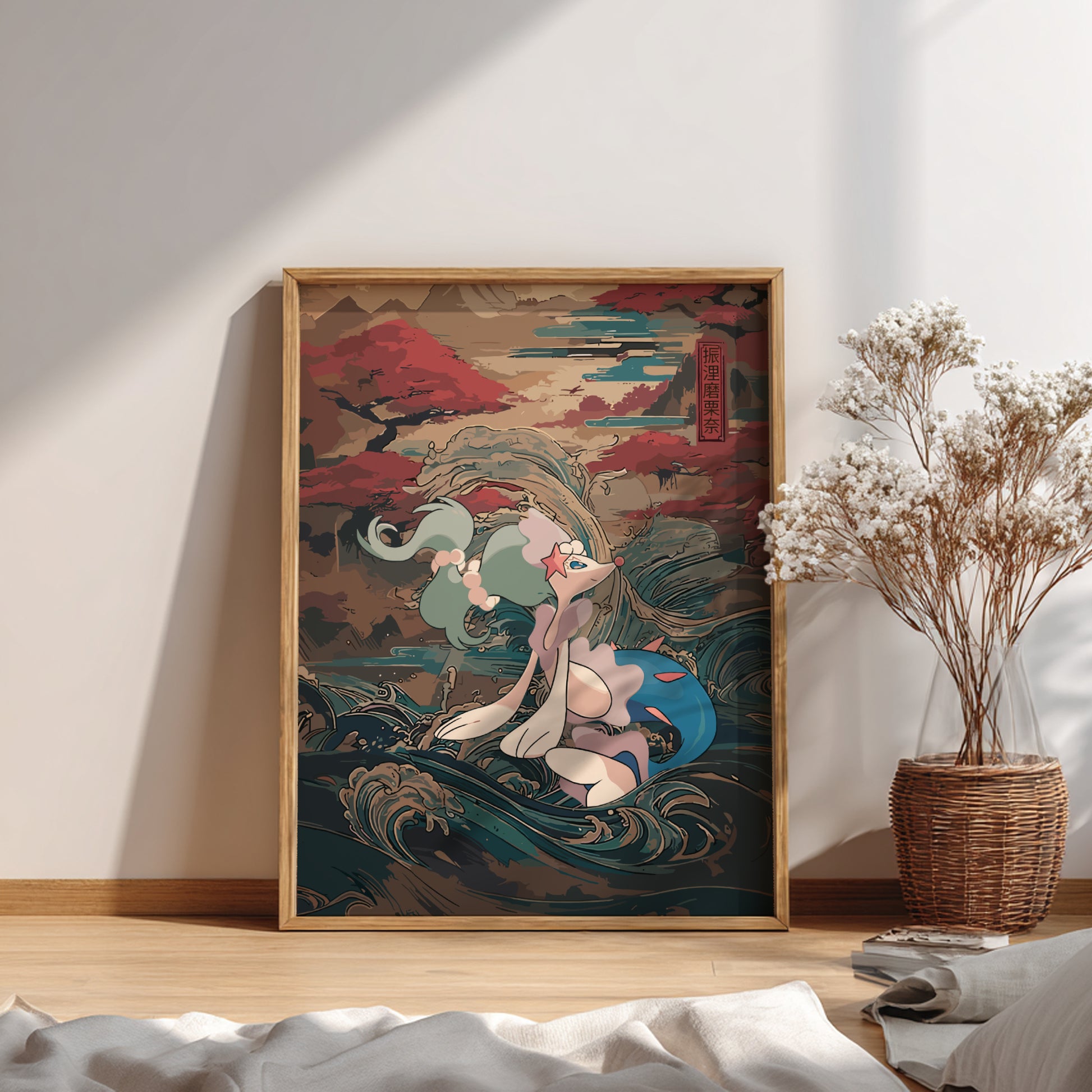 Framed artwork of a stylized Primarina Pokemon on a wall with a vase of dried flowers below.