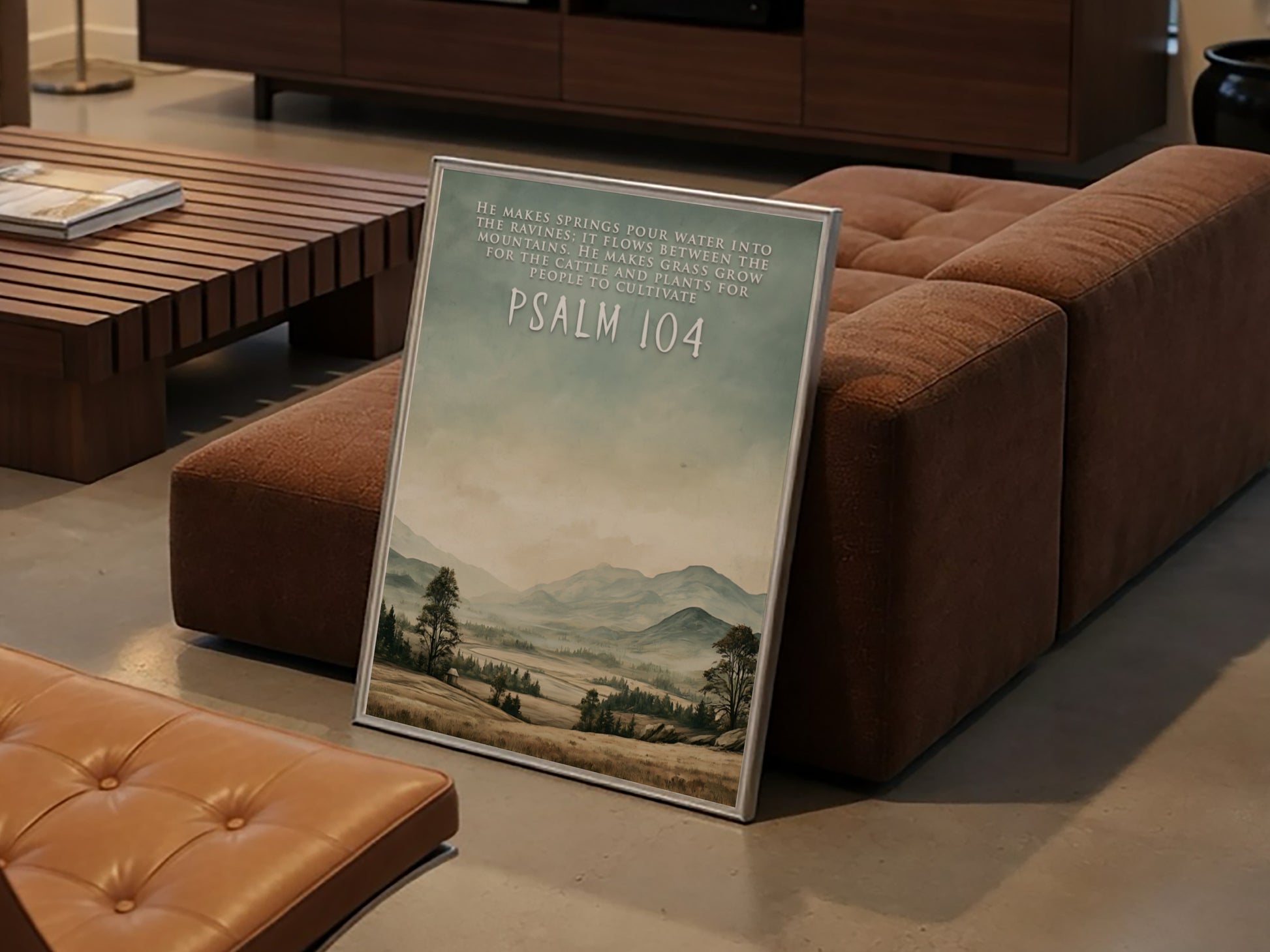 Poster featuring a serene mountain landscape with soft green and earthy brown tones.