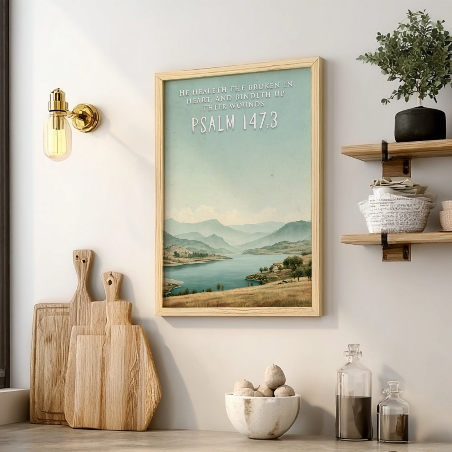 Poster featuring a serene lake and hills with the quote He Healeth the Broken