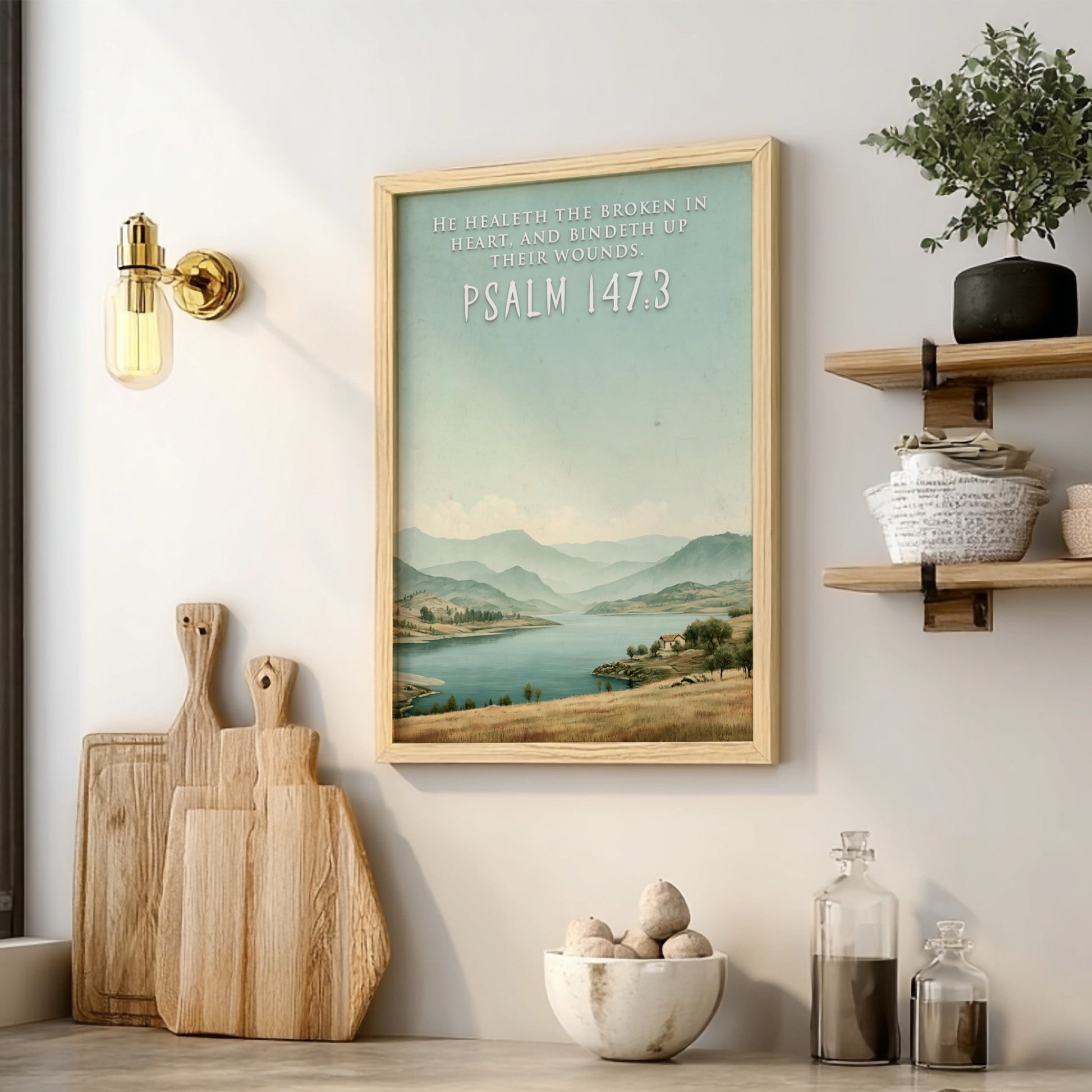 Poster featuring a serene lake and hills with the quote He Healeth the Broken