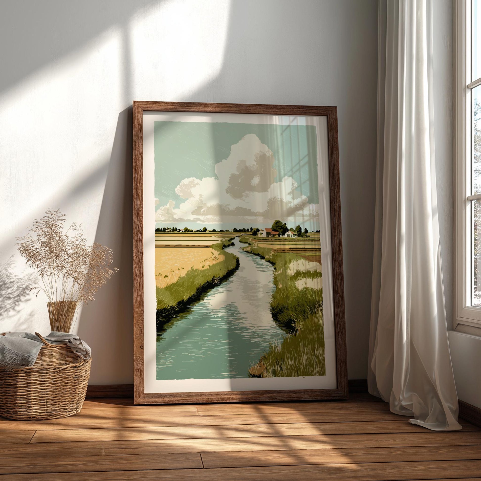 Framed landscape print of a river scene on a wall in a bright room with sunlight streaming in.