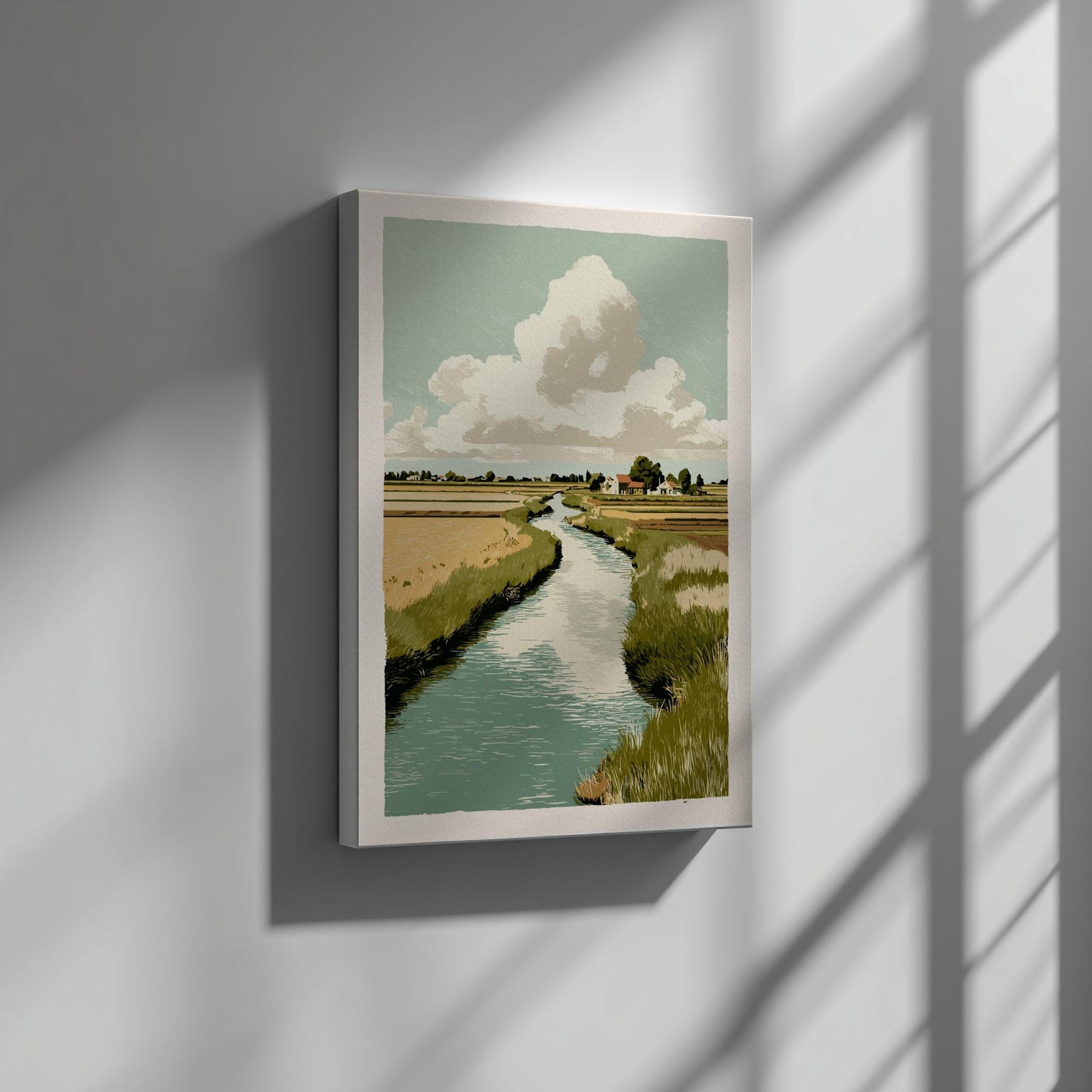 Canvas artwork of a landscape with a river and clouds on a wall.