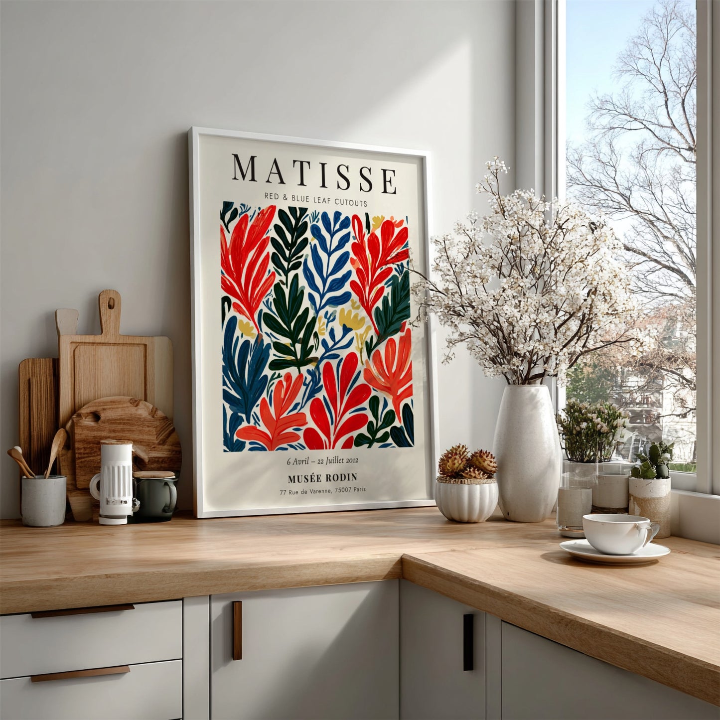 Henri Matisse poster featuring red and blue leaf cutouts in vibrant colors and bold style