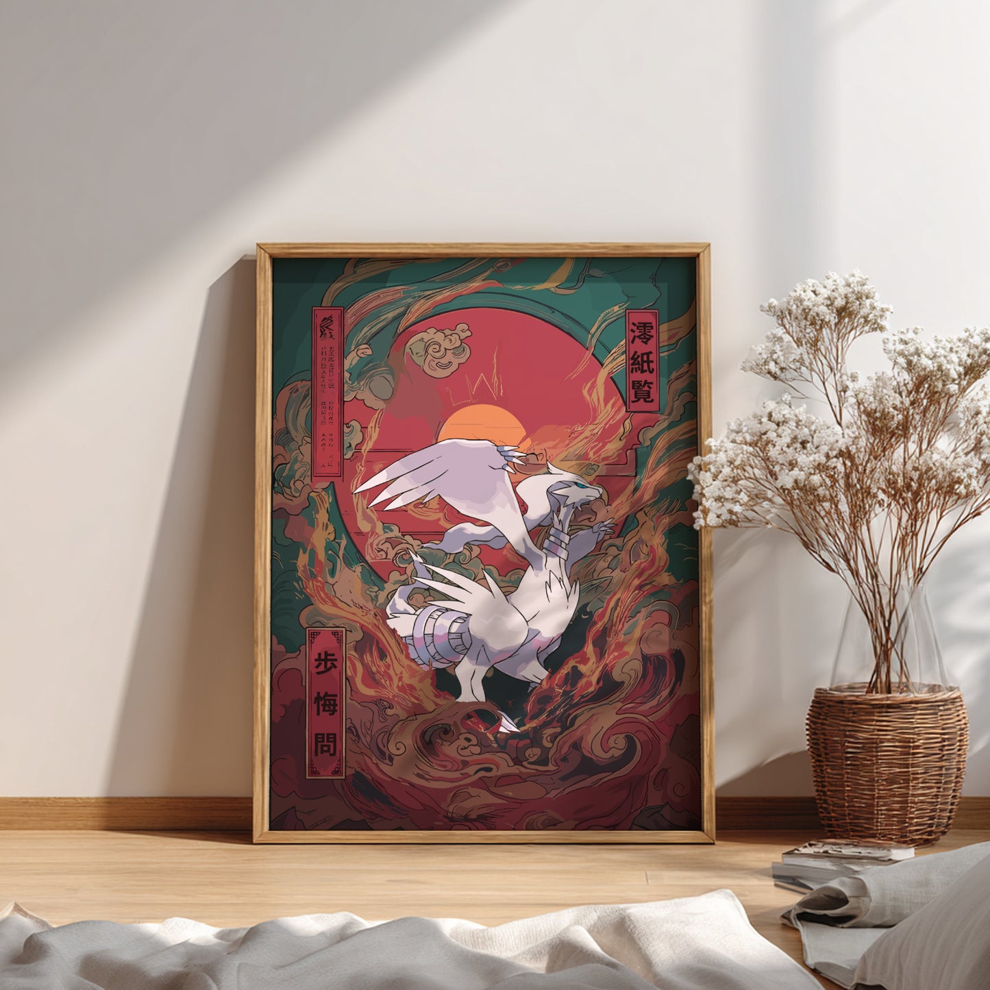 Framed artwork with a Reshiram Pokemon design on a wall in a room with a vase of flowers.