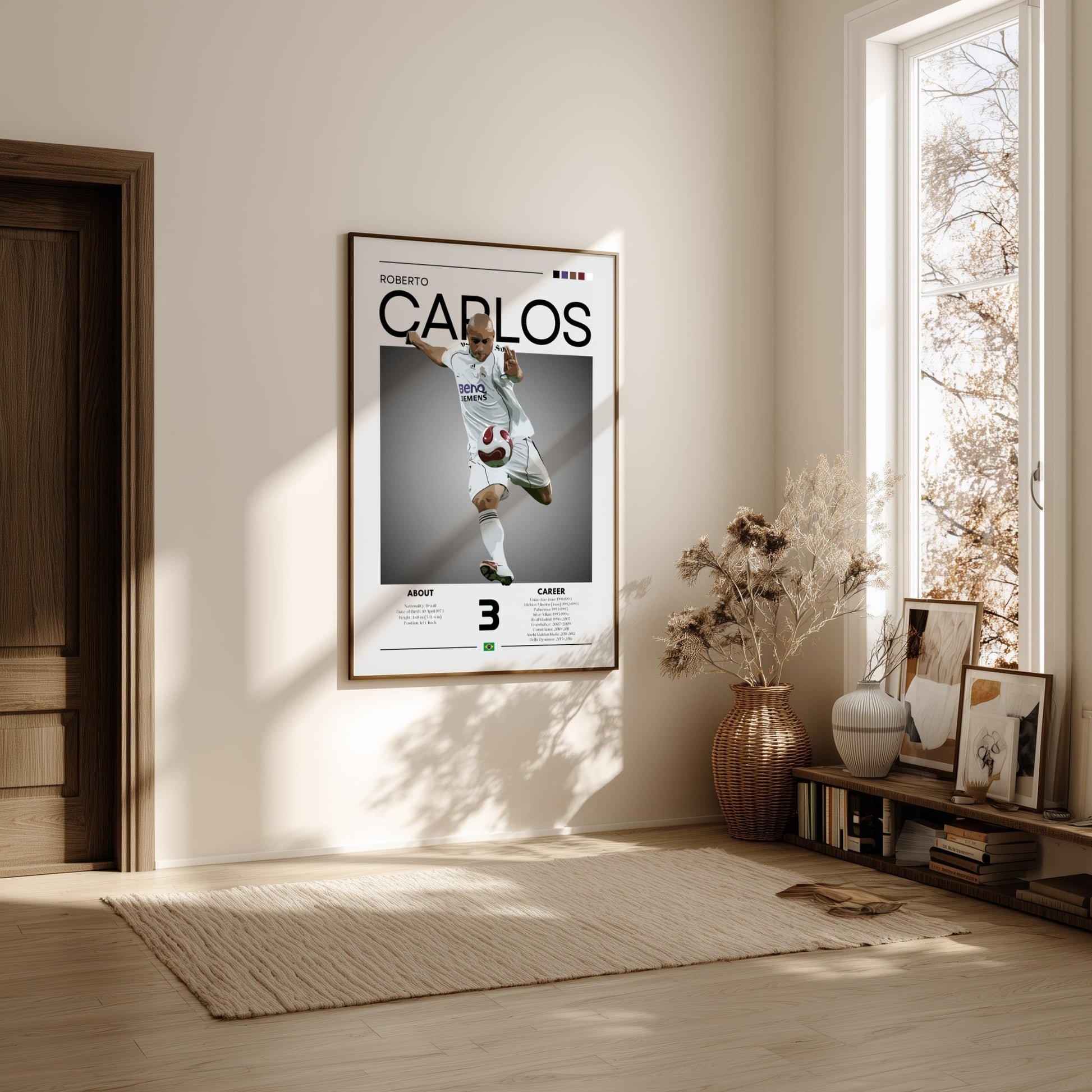 Framed poster of a soccer player named 'Carlos' in a room with natural light