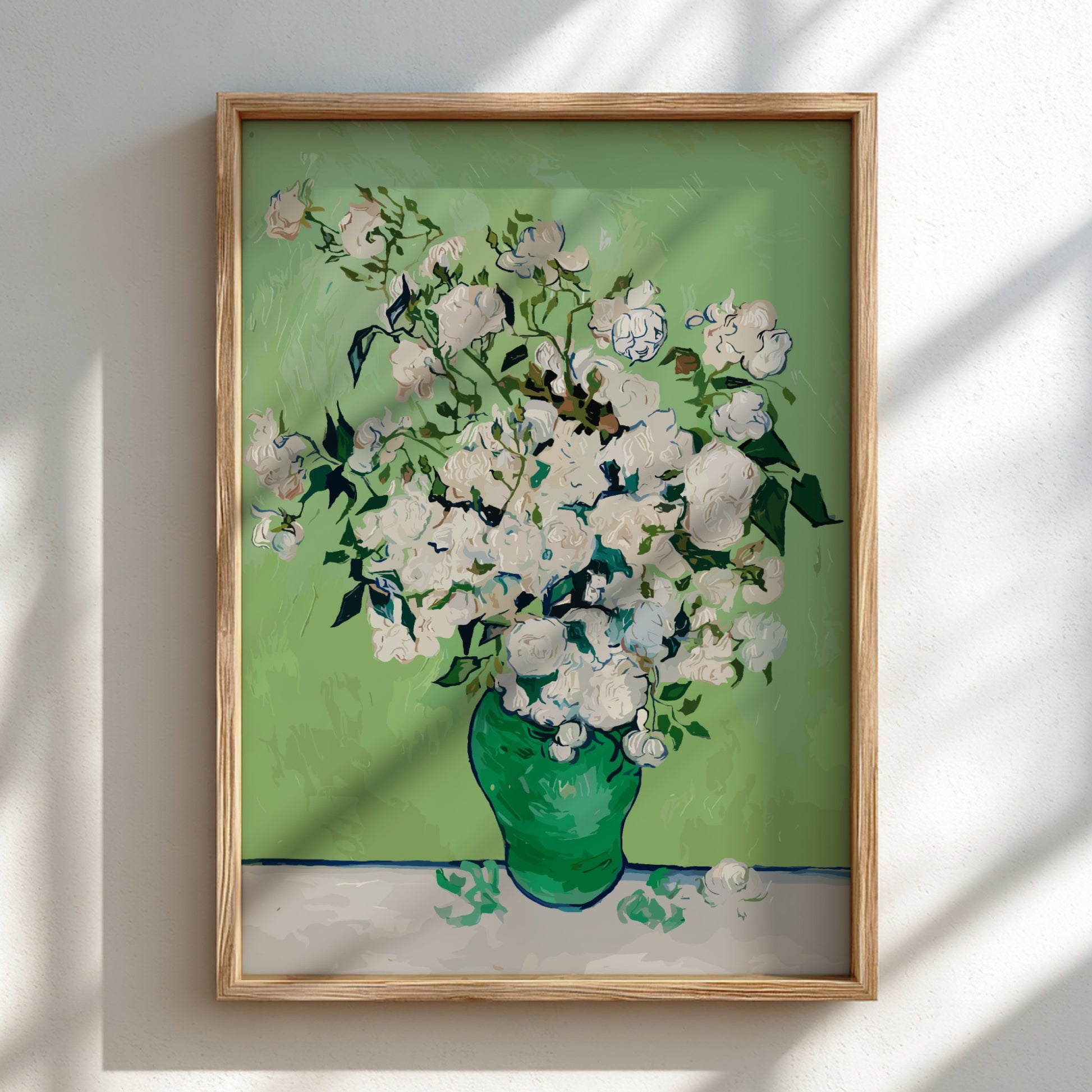 Vincent van Gogh's White Roses art poster in a green vase on a table.
