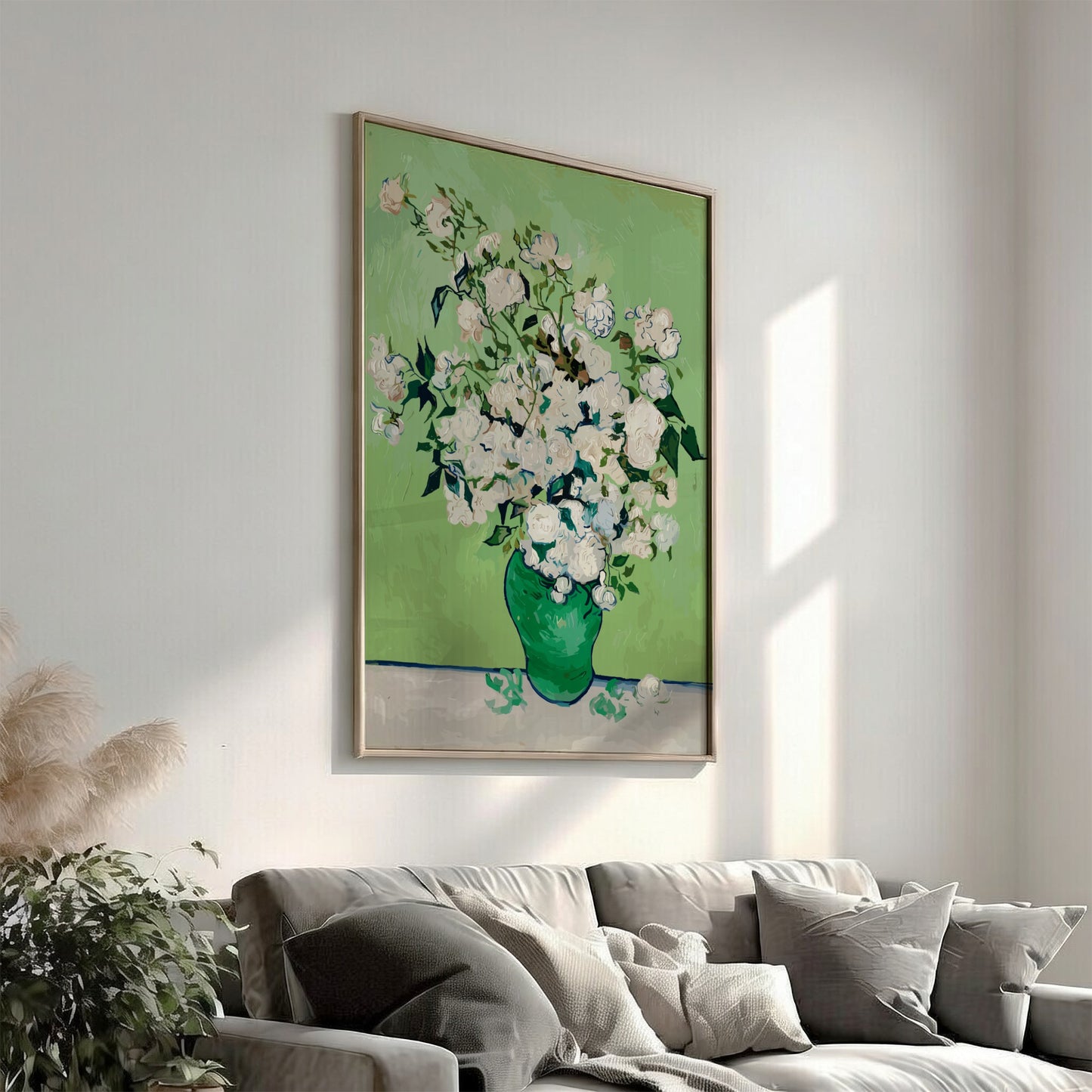 Vincent van Gogh's White Roses art poster in a green vase on a table.