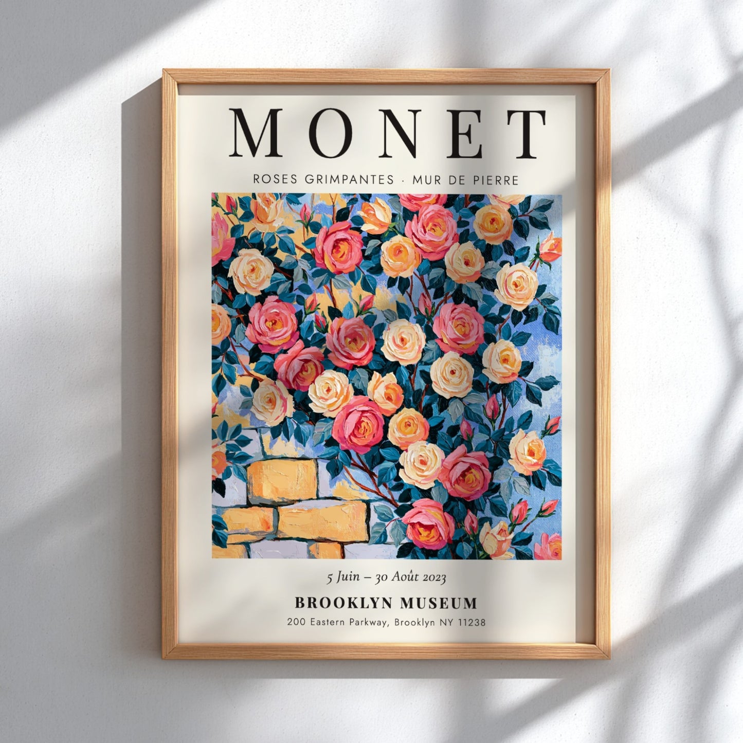 Monet-inspired wall art featuring vibrant roses and stone wall details