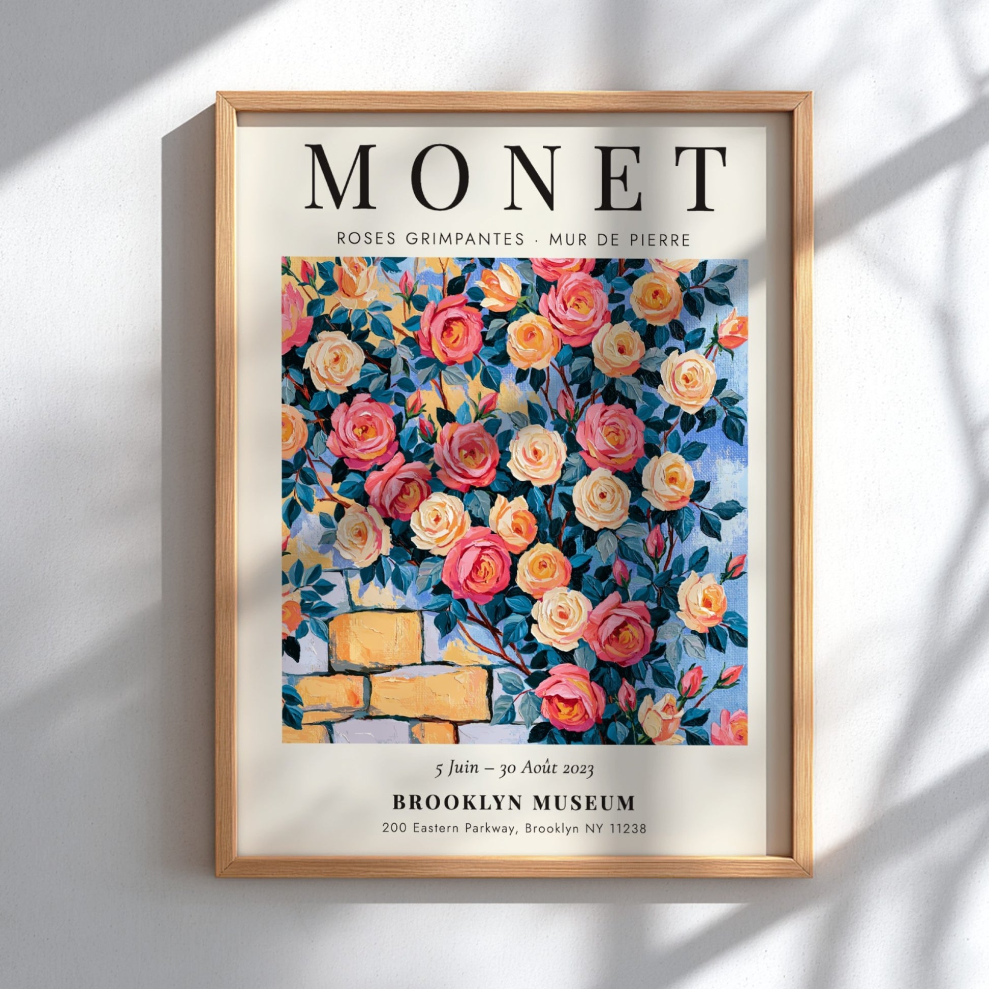 Monet-inspired wall art featuring vibrant roses and stone wall details