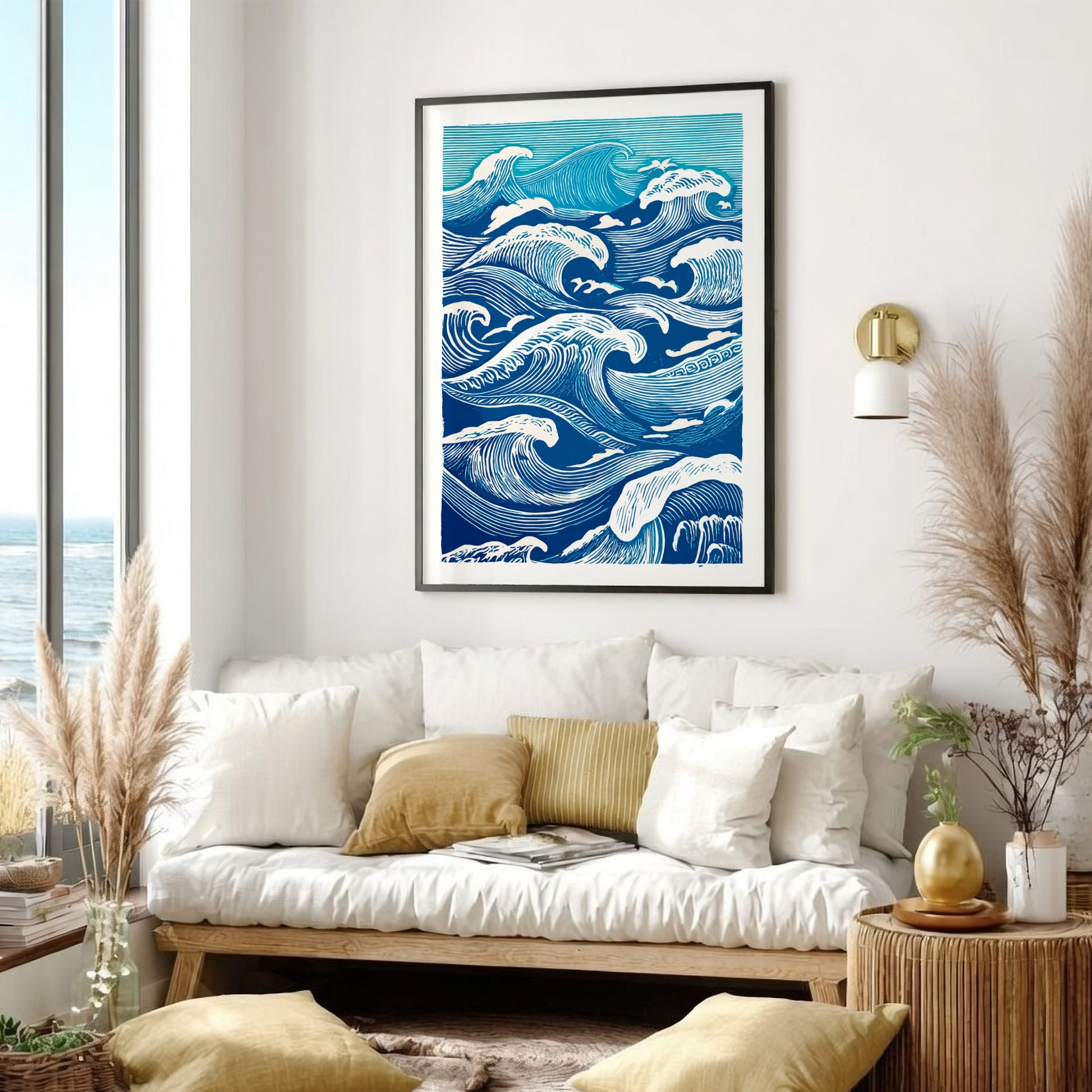 Living room with a white sofa, decorative pillows, and a framed wave art print on the wall.