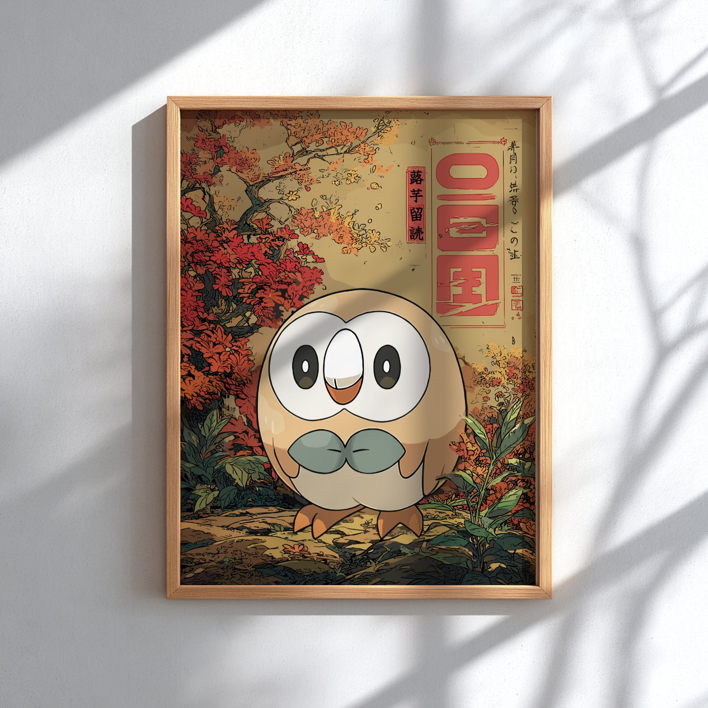 Framed artwork with Rowlet Pokemon character and autumn scenery