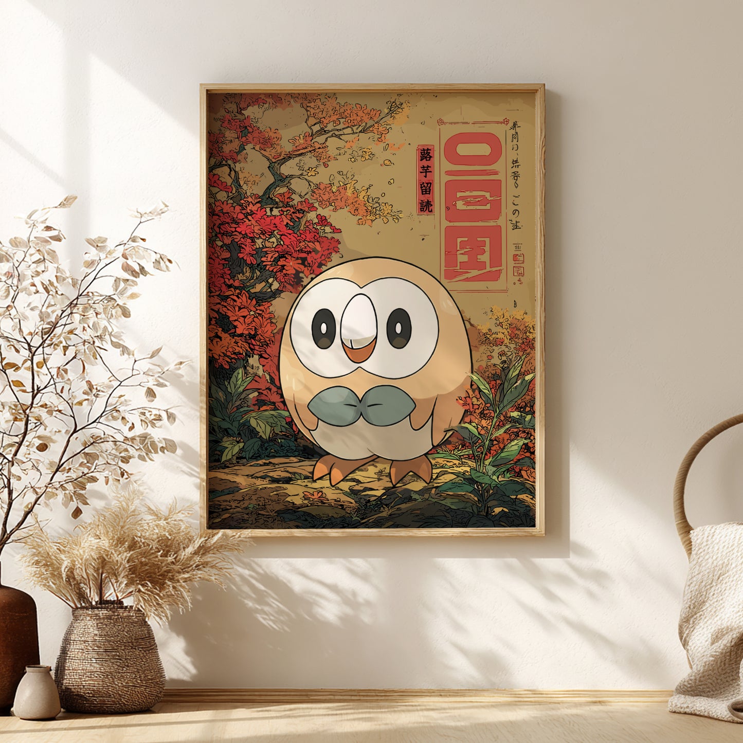 Framed artwork of Rowlet Pokemon with autumn leaves and text on a wall.