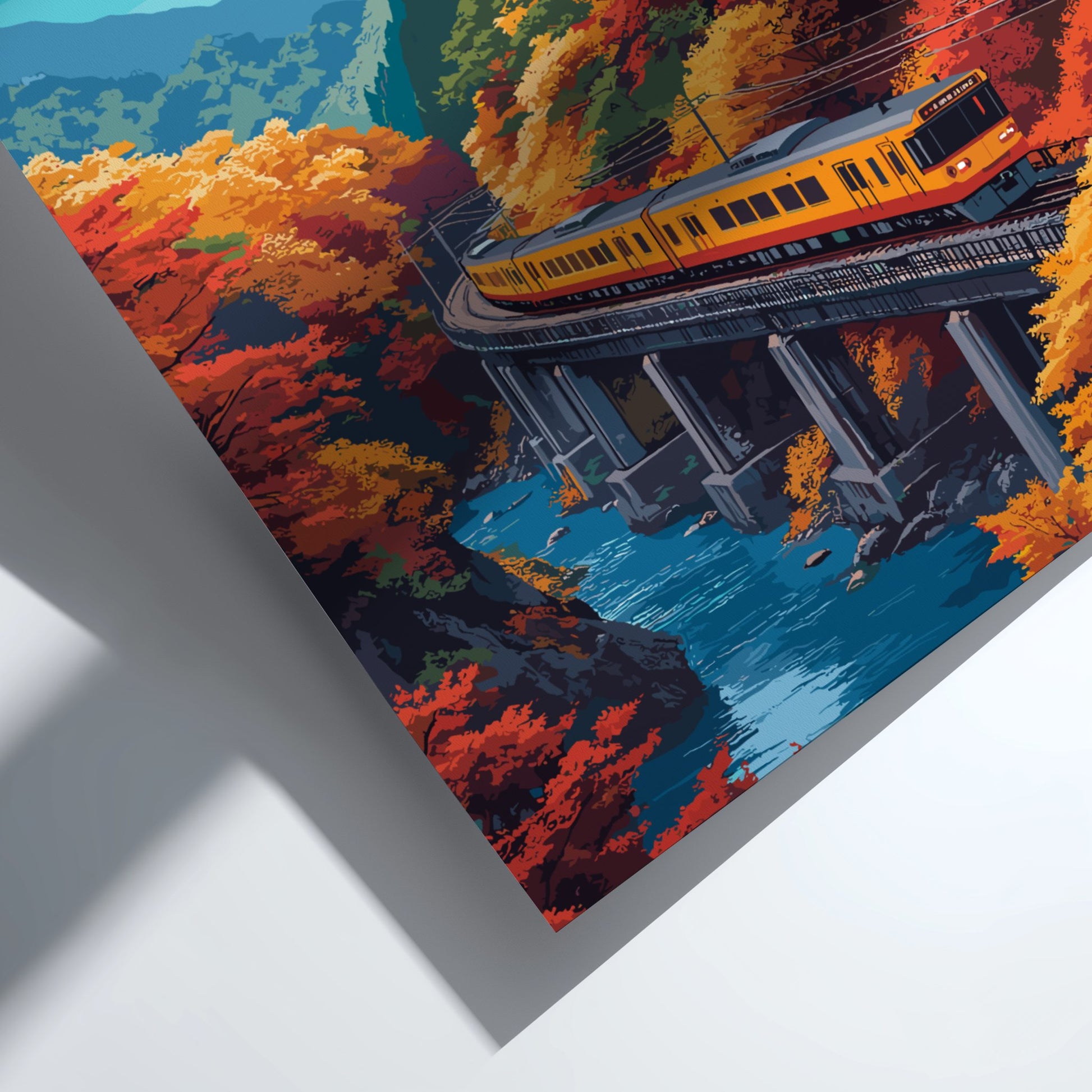 Train on a bridge with autumn foliage and water below