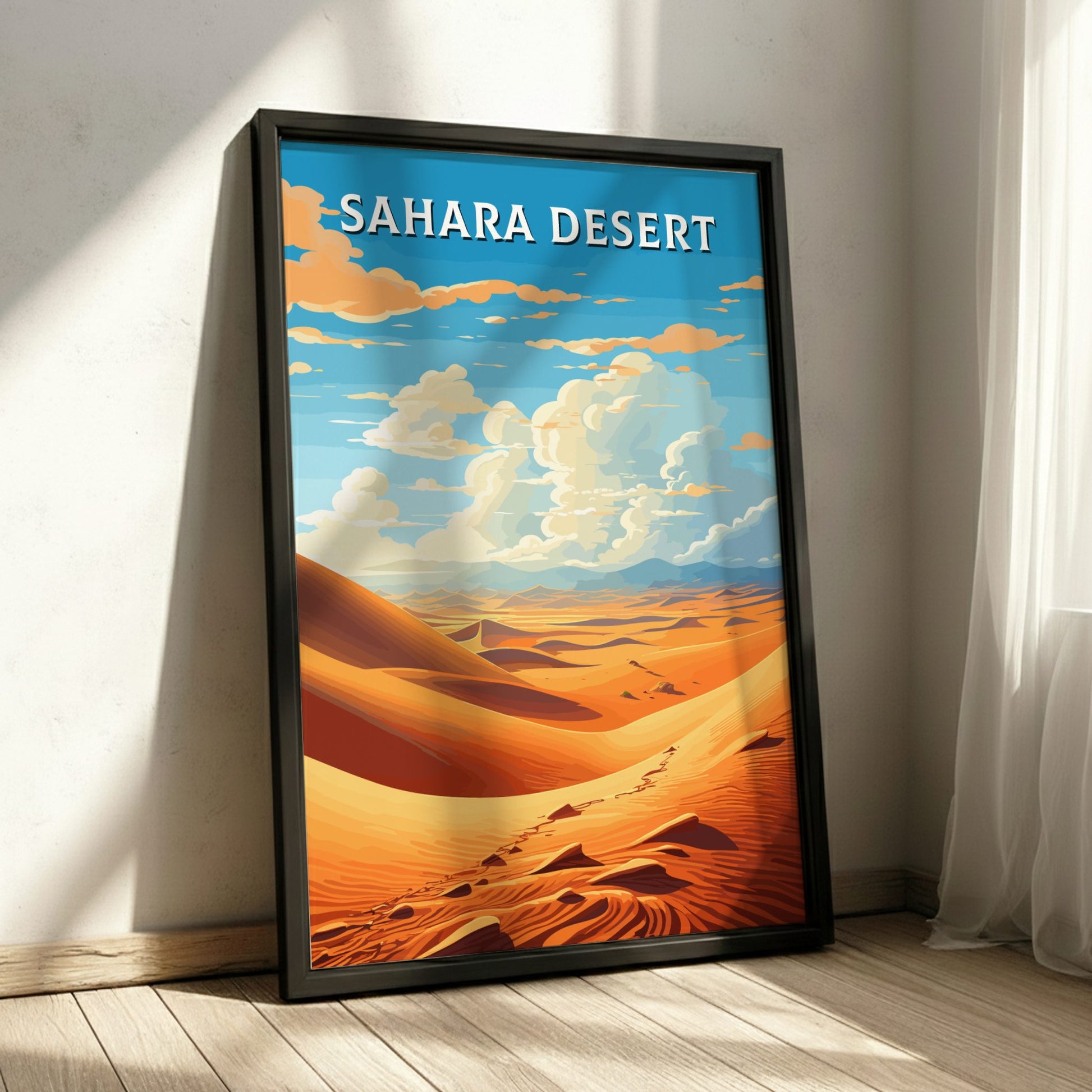Framed poster of the Sahara Desert with a blue sky and orange sand dunes.